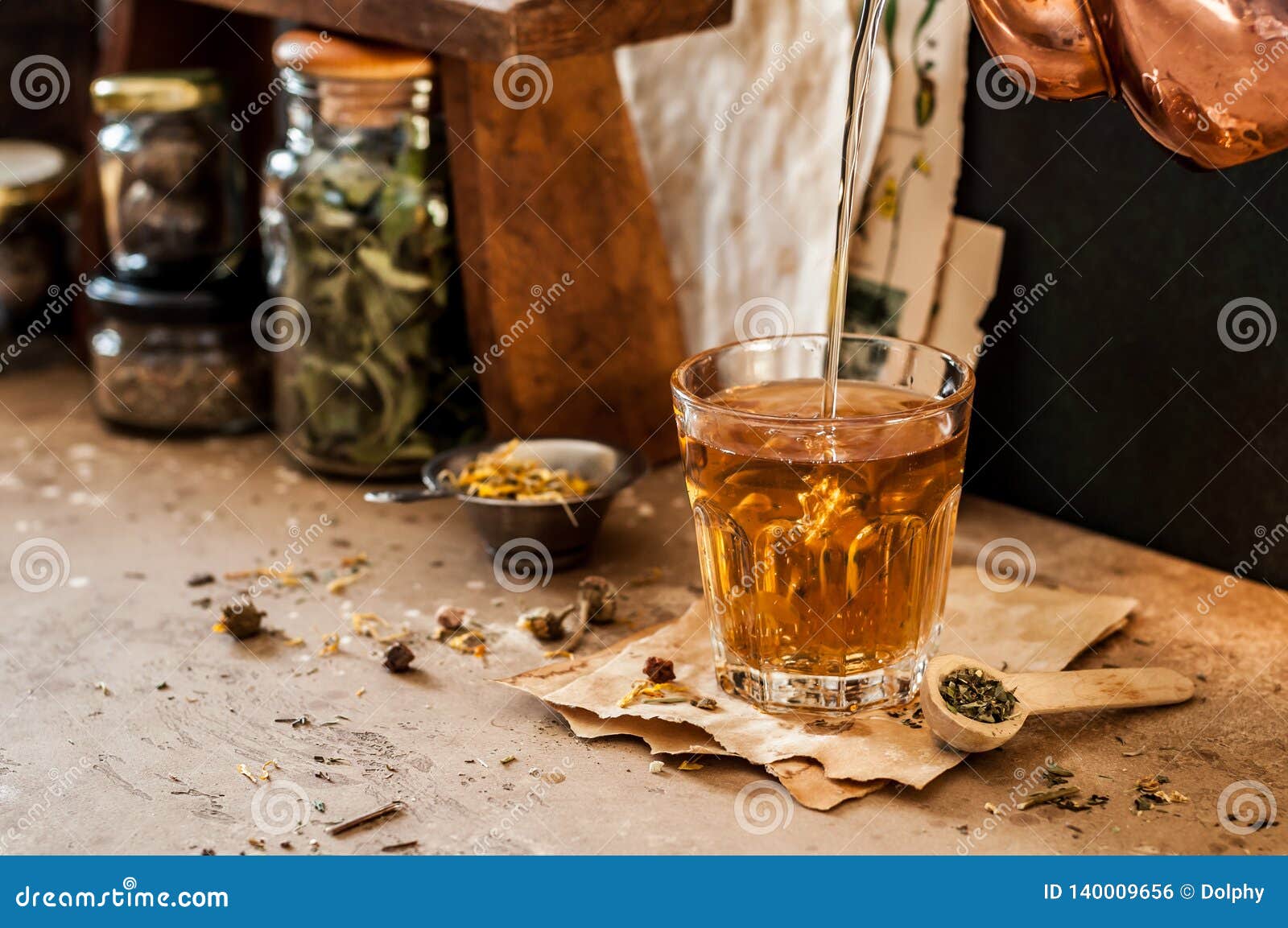 Pouring Herbal Tea stock photo. Image of concrete, green - 140009656