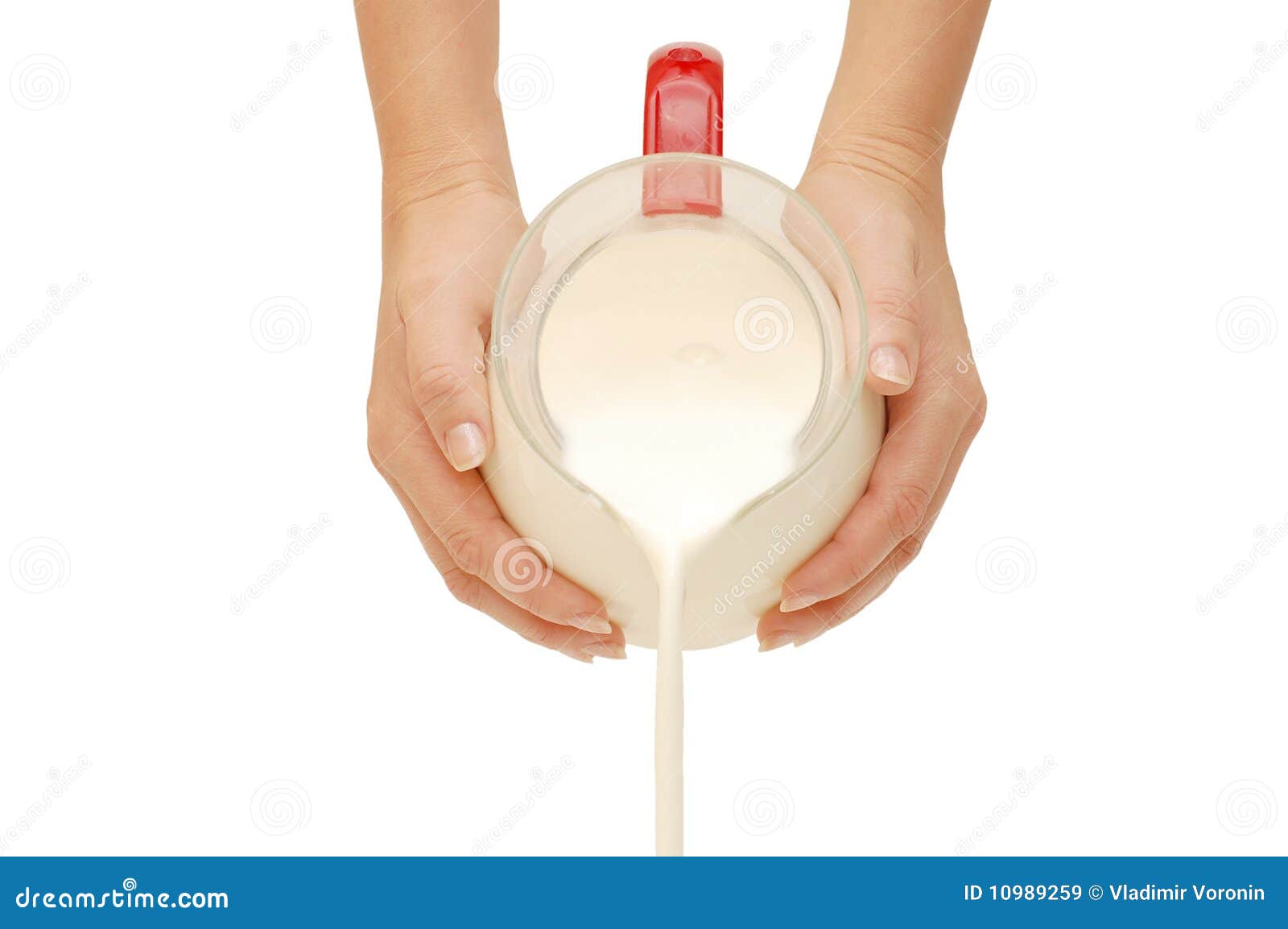 Pouring of milk from a jug stock image. Image of vertical 10989259