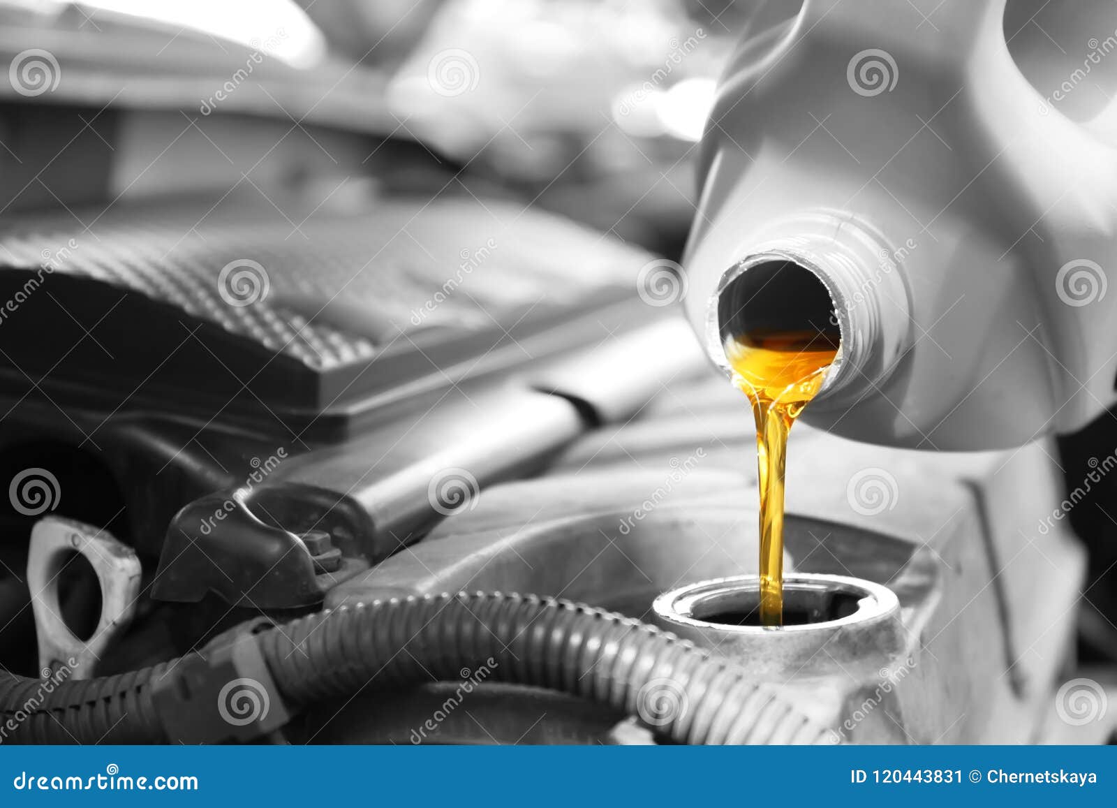 Red Engine Oil Pouring From A Canister In Hand Isolated On White