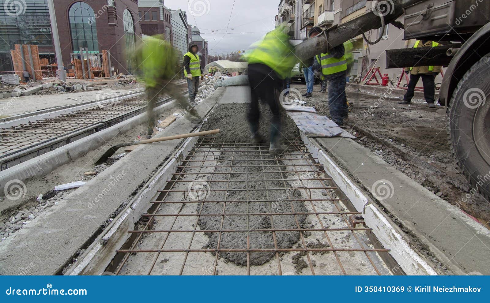 pouring ready-mixed concrete after placing steel reinforcement to make the road by concrete mixer timelapse hyperlapse.