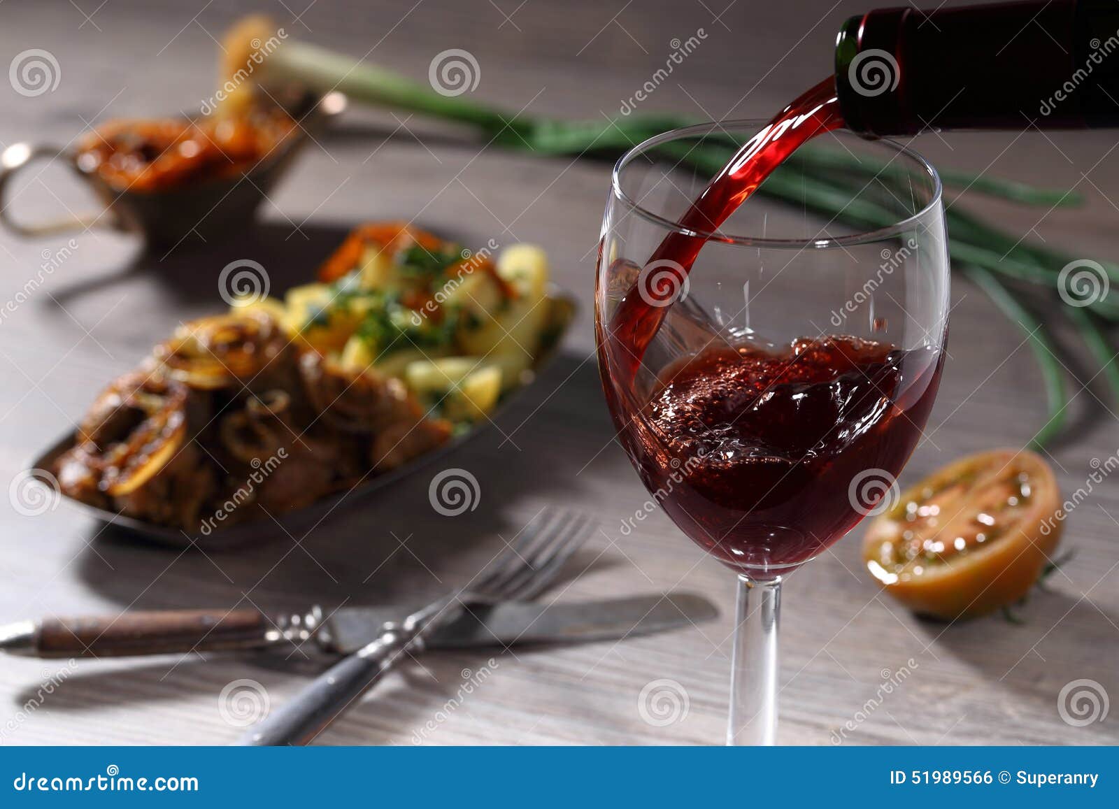 Pouring red wine and food stock photo. Image of plate 51989566