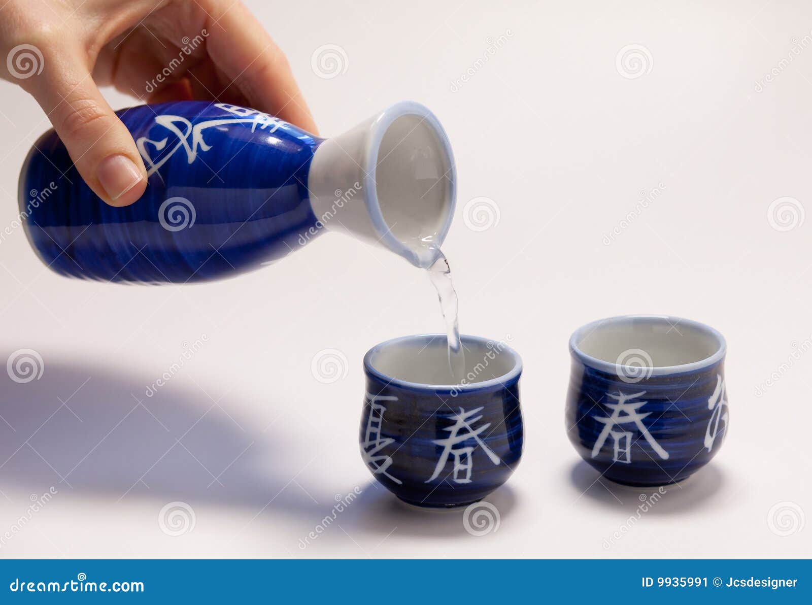 Pouring sake stock image. Image of carafe, drink, container 9935991