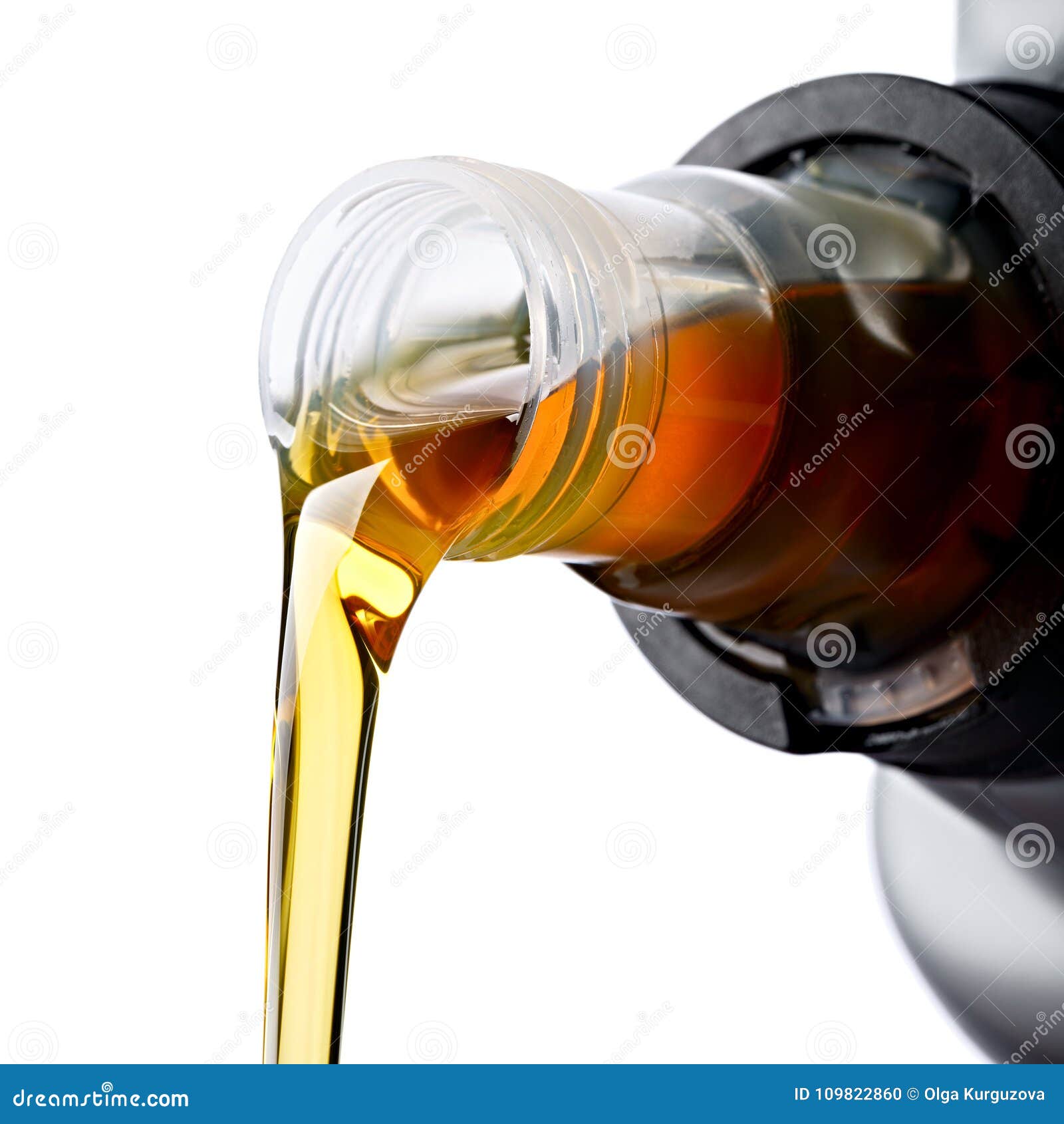Pouring Synthetic Oils For Car Engine On Dark Background. RoyaltyFree