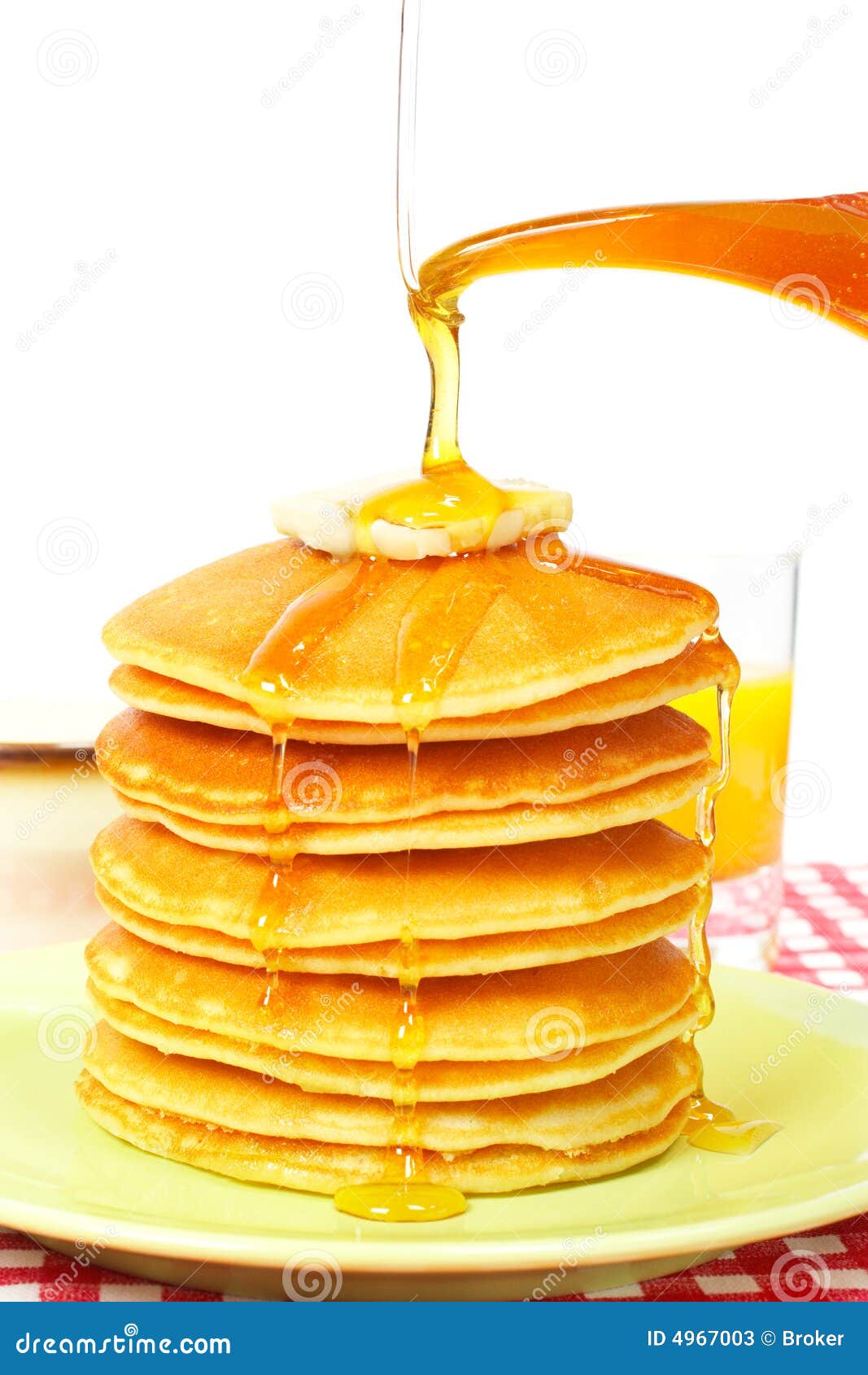 pouring syrup on the pancakes