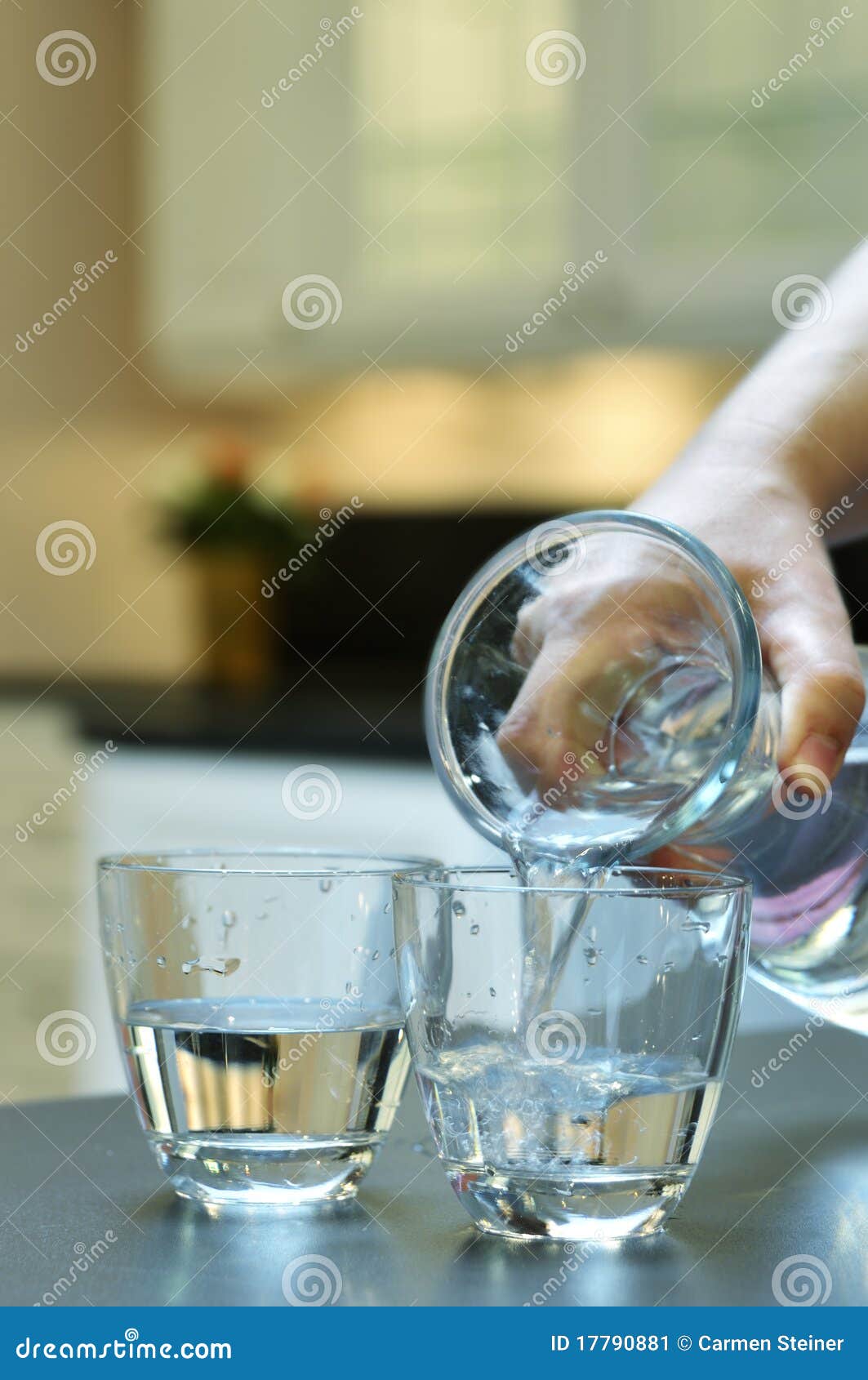 pouring water into a glass