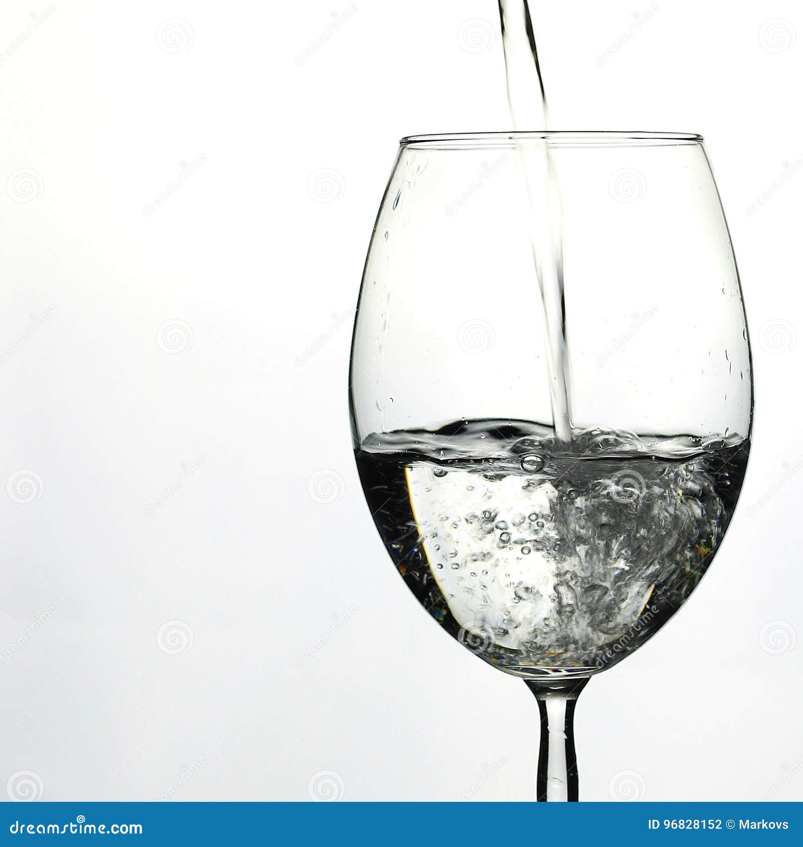 Pouring Water into Wine Glass Stock Photo Image of hold, motion 96828152