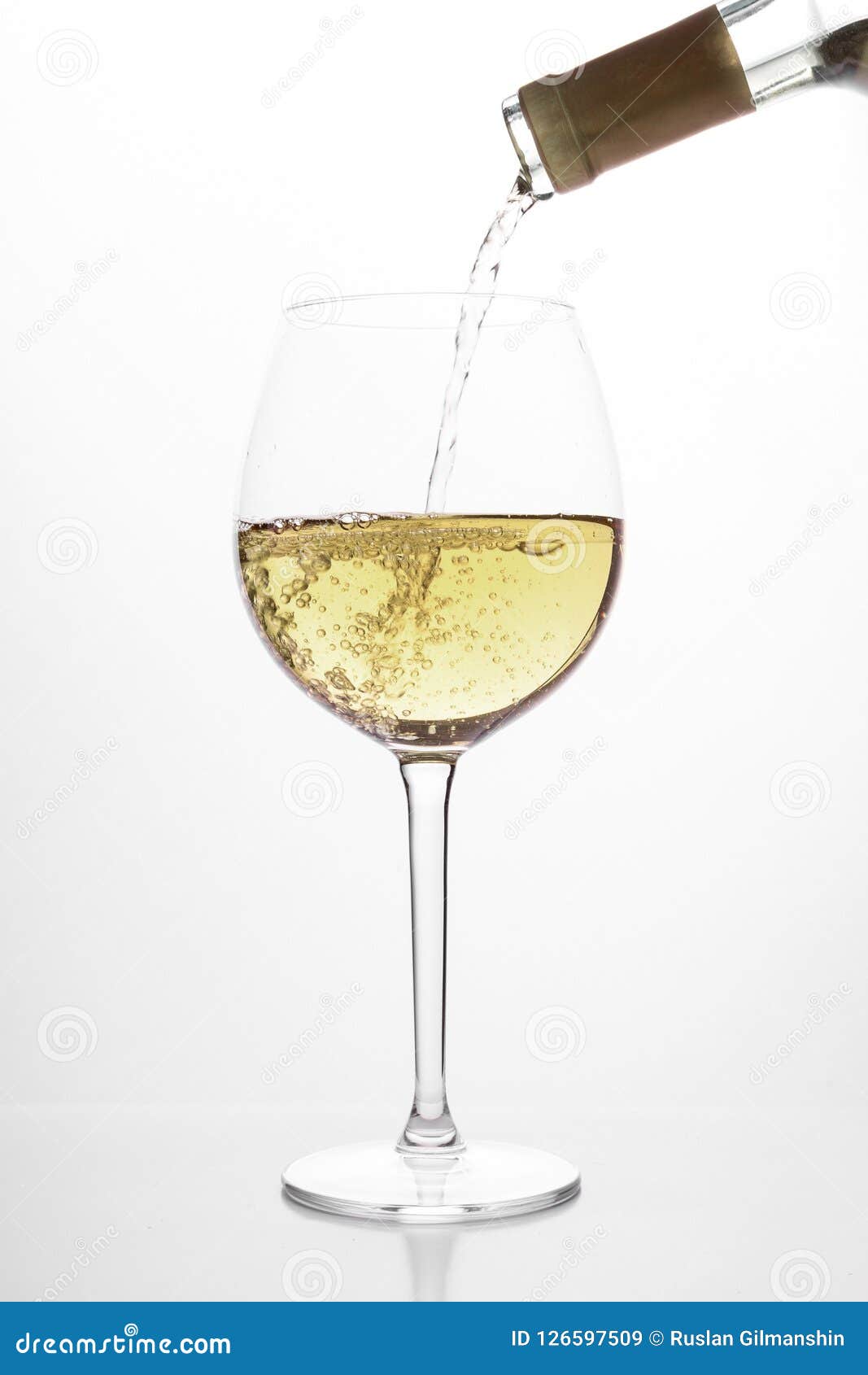 Pouring White Wine into Glass, on White Background Stock Image Image