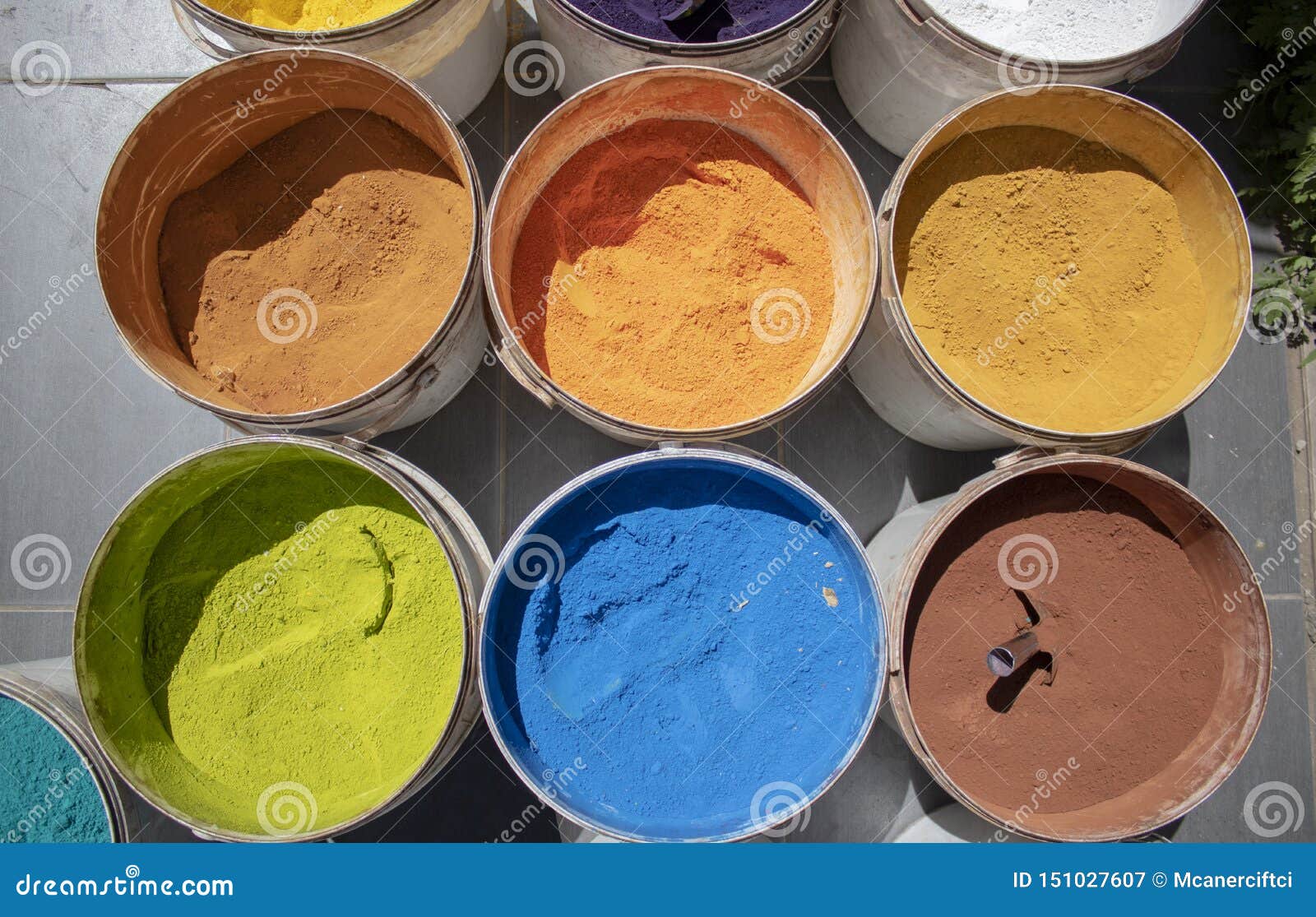 powder coating cans. various colors. photographed on a sold out counter