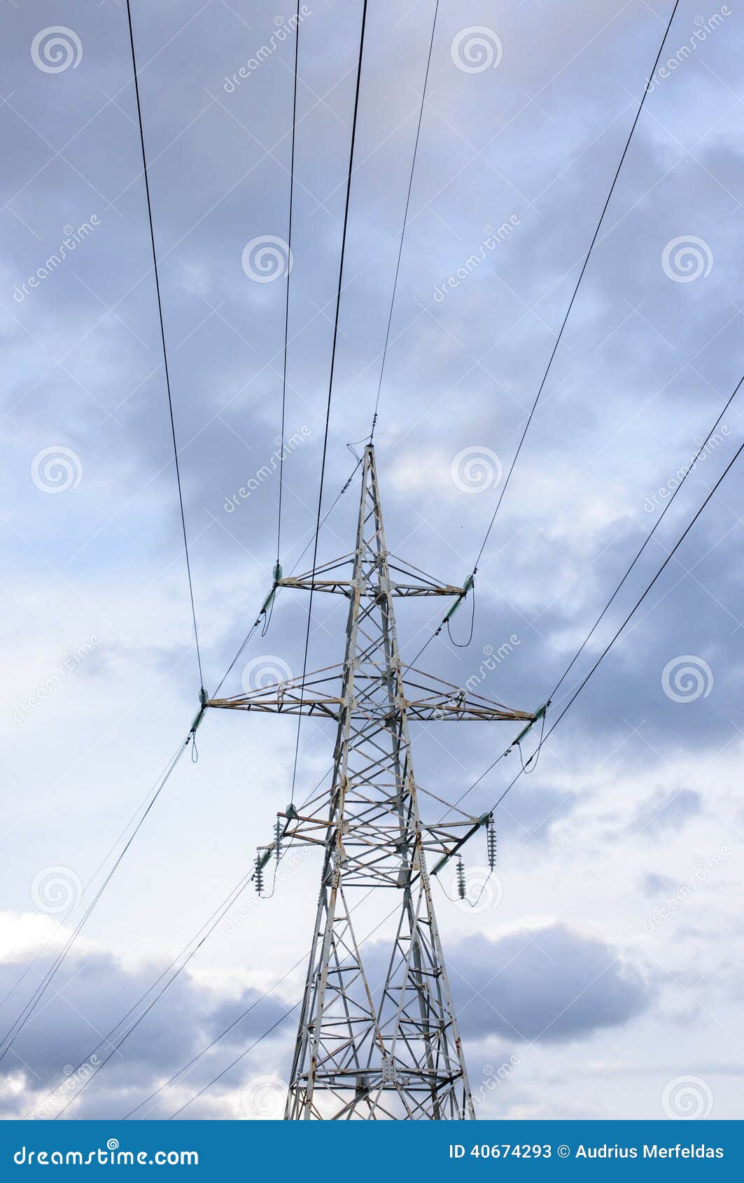 Power Line and Electricity Tower in Front of Cloudy Sky Stock Image