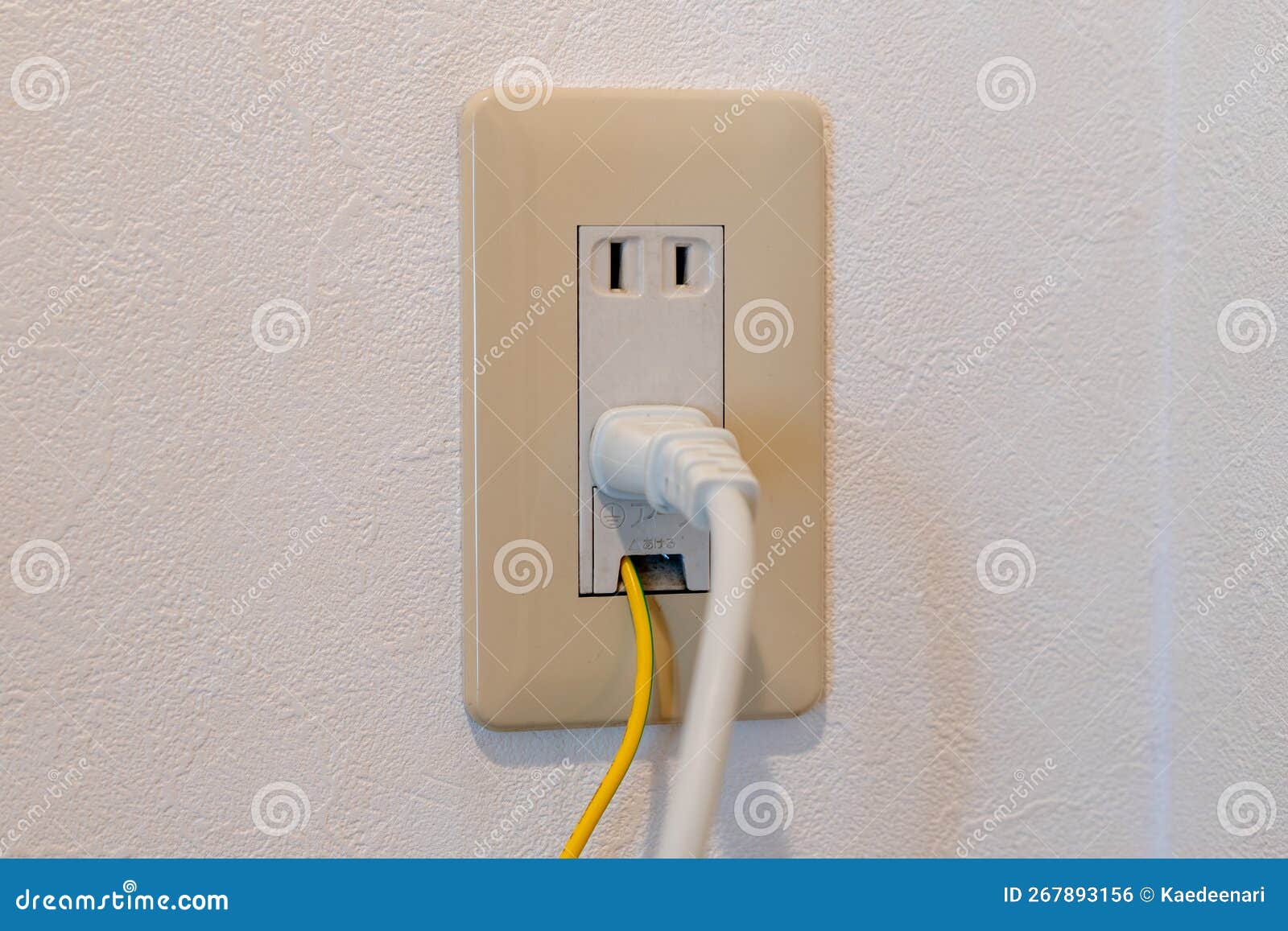 Power Plug and Earth Wire Connected To Japanese Electrical Outlet
