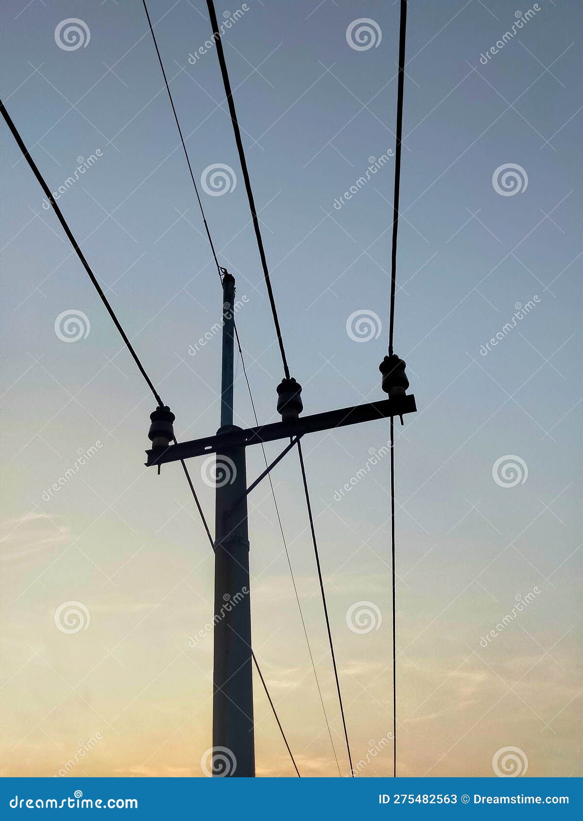 The Power Pole Has Electrical Cables Hanging Above it Stock Image