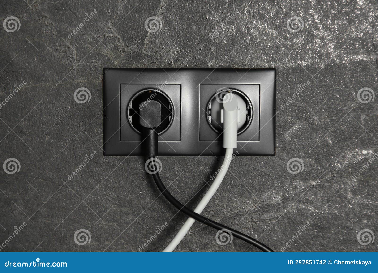 Power Sockets with Inserted Plugs on Dark Grey Wall. Electrical Supply Stock Photo Image of