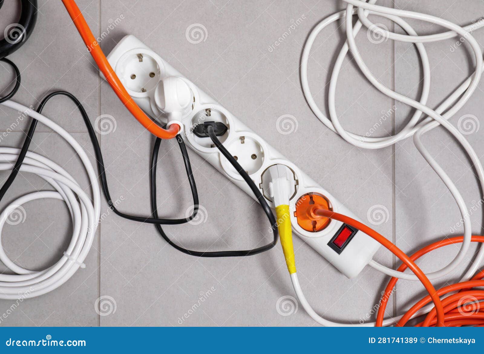 Power Strip with Electrical Plugs on Grey Floor, Flat Lay Stock Image Image of outlet