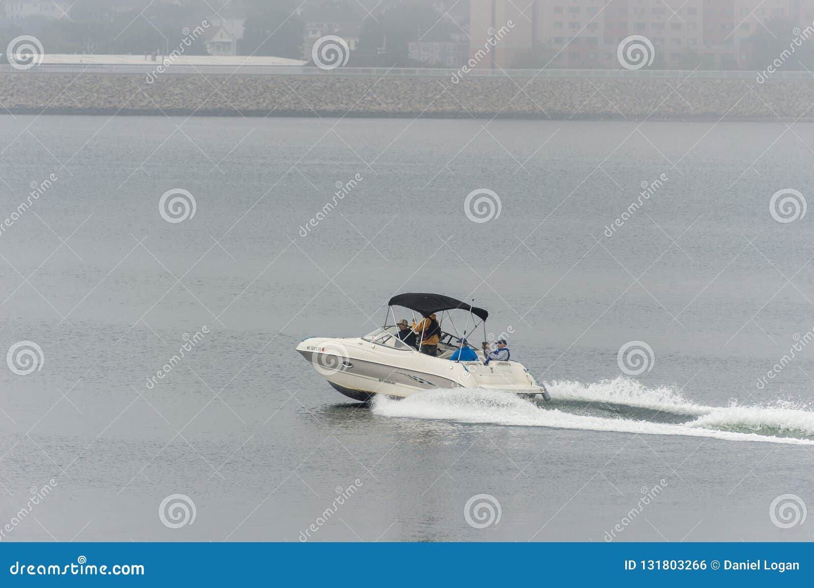 powerboat underway in the fog