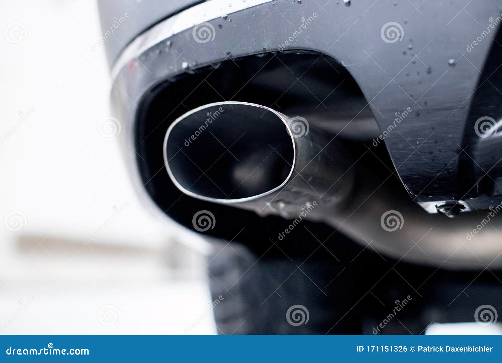 Powerful Car with Exhaust Pipe, Pollution and Fine Dust Stock Photo