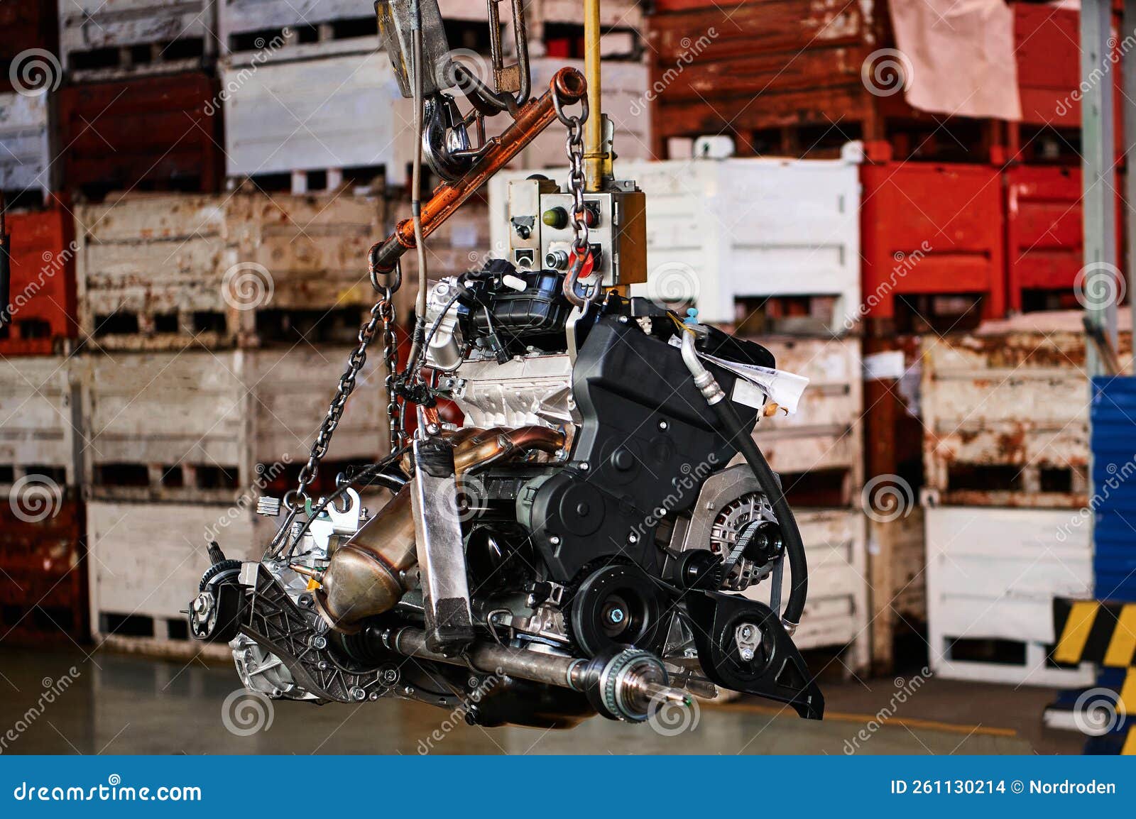 Powerful Car Motor Hangs on Chains in Assembling Stock Photo