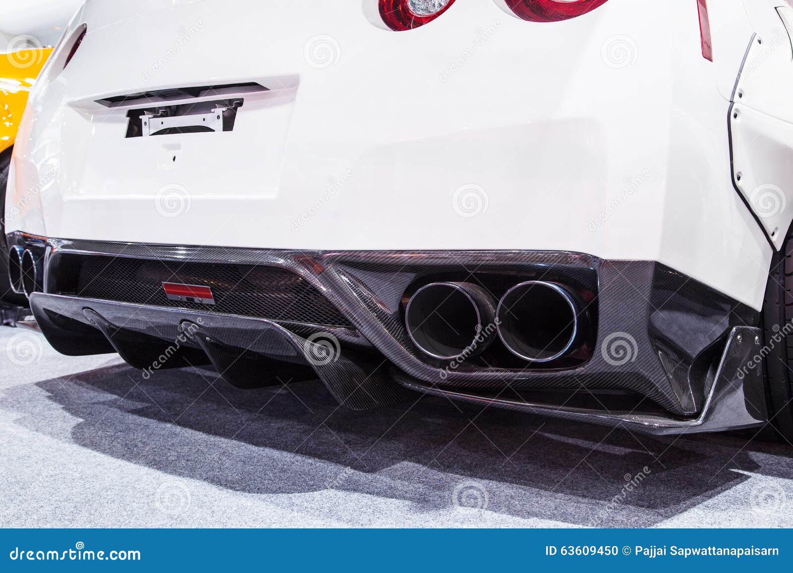Powerful Double Exhaust Pipe of a White Sports Car Stock Photo Image