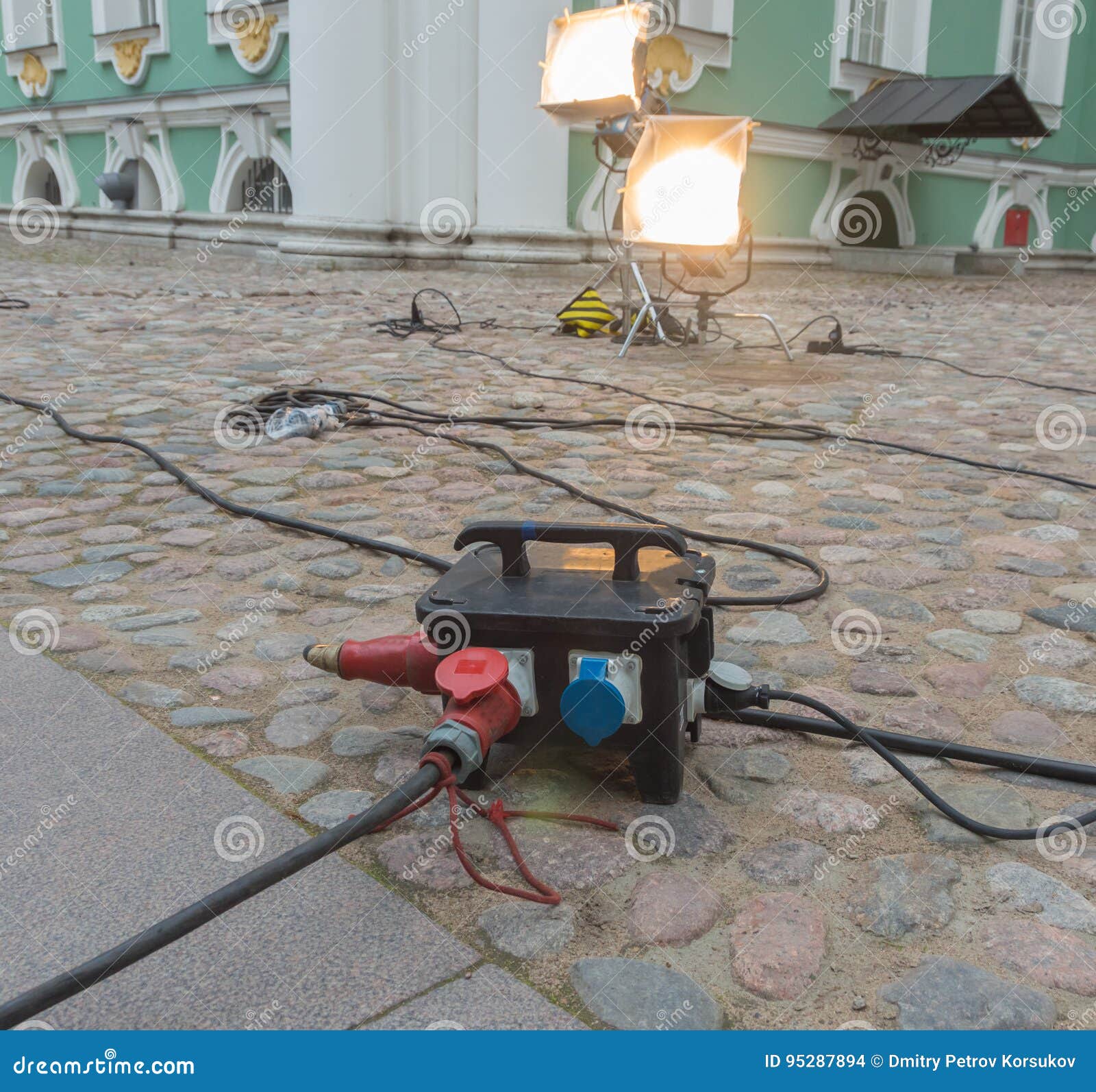 Powerful Hooks Extension Cords Near a Historic Building. Stock Photo Image of machine, current