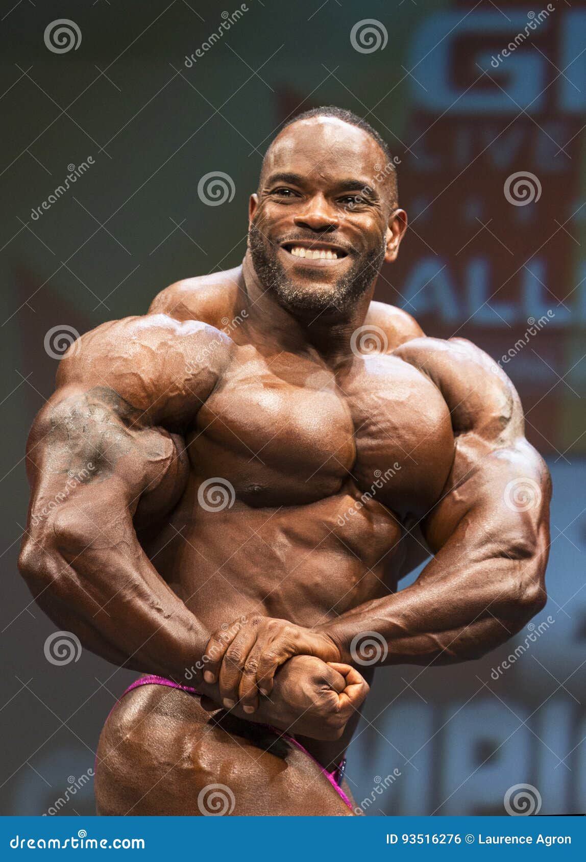 Powerful Male Bodybuilder with Tattoo Editorial Photo - Image of