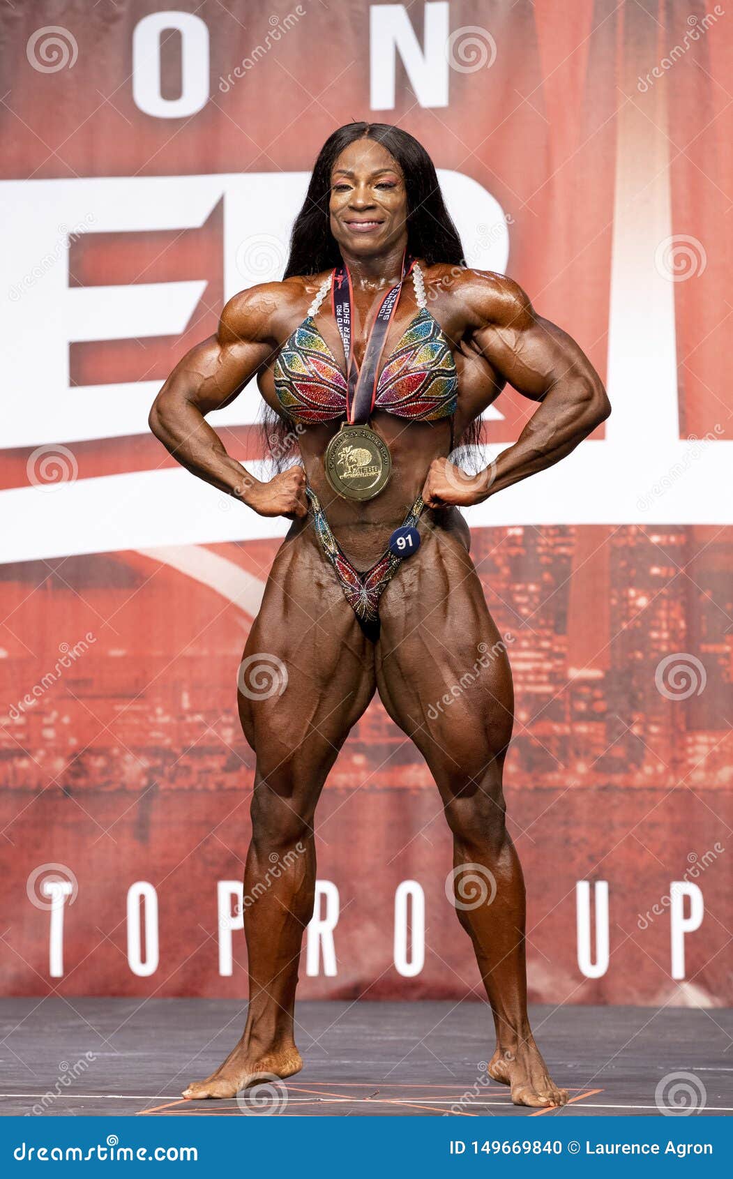 powerful margie martin atlanta georgia flashes front lats pose her winning medal toronto pro supershow major 149669840