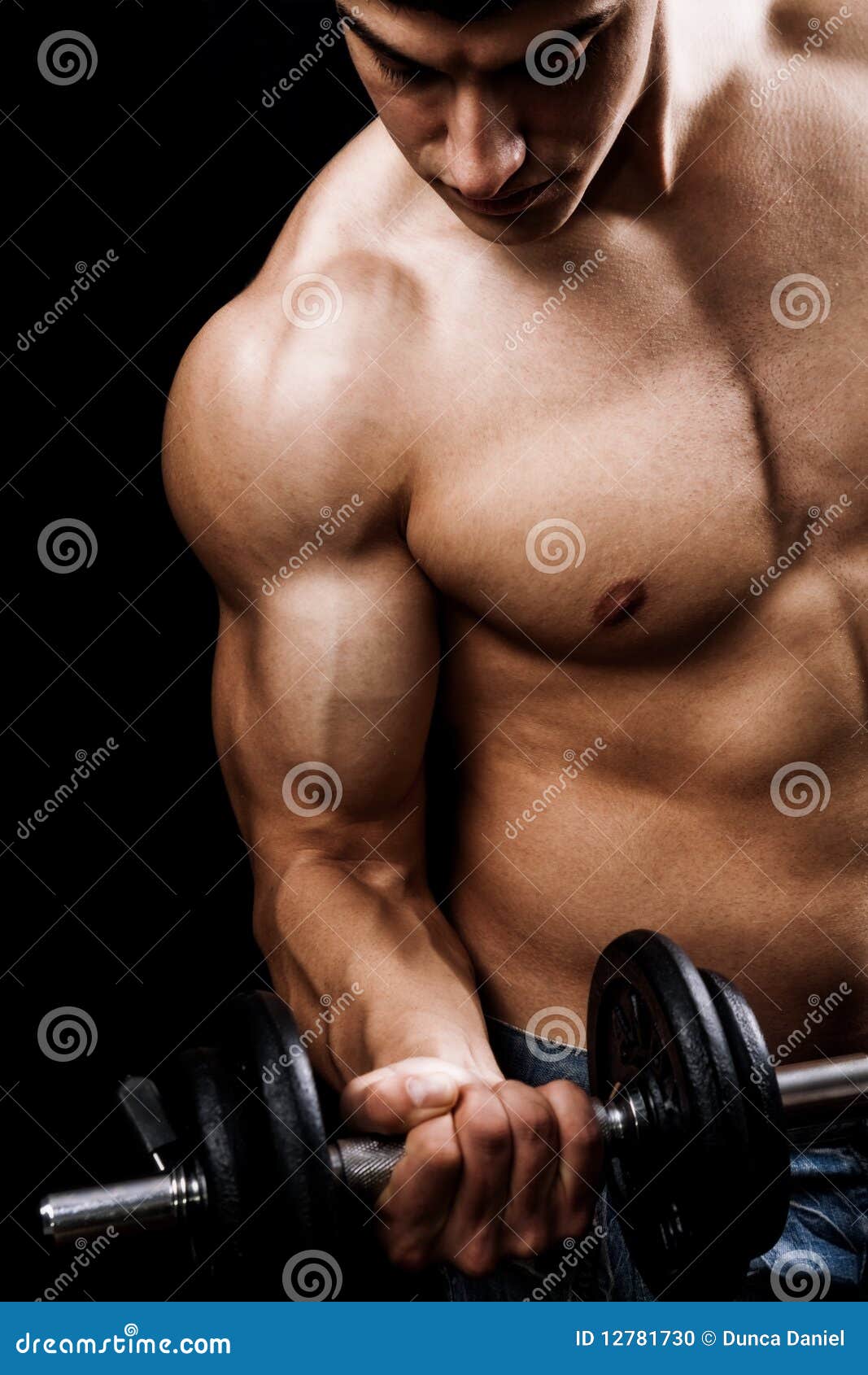 powerful muscular man lifting weights