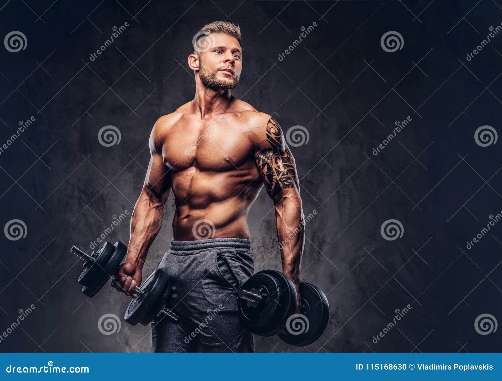 A Handsome Shirtless Tattooed Bodybuilder with Stylish Haircut and