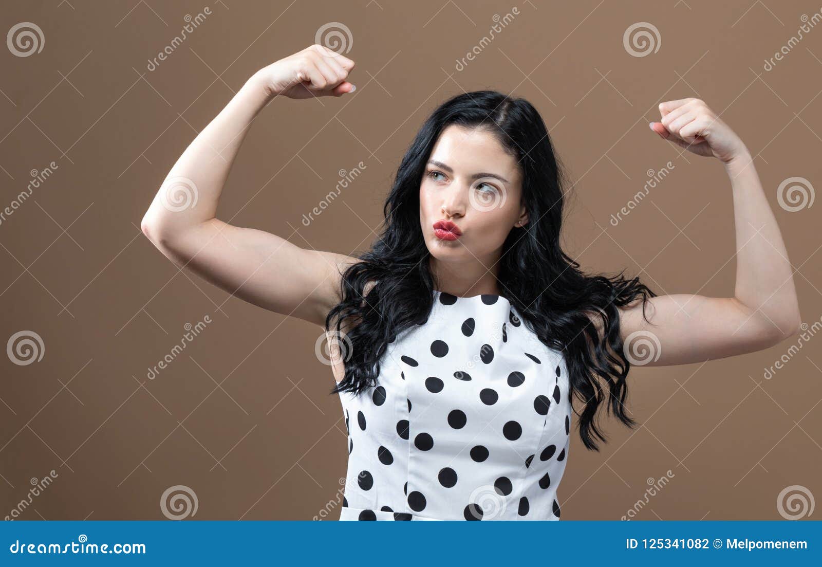 Powerful young woman in success pose - stock photo 852551 | Crushpixel