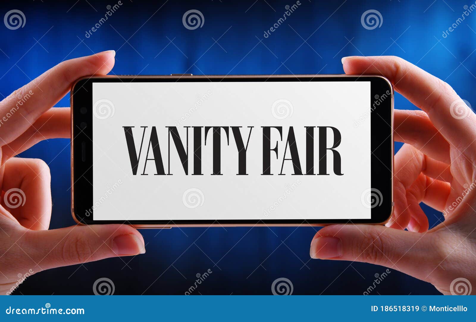Hands Holding Smartphone Displaying Logo of Vanity Fair Editorial Stock  Image - Image of digital, illustrative: 186518319