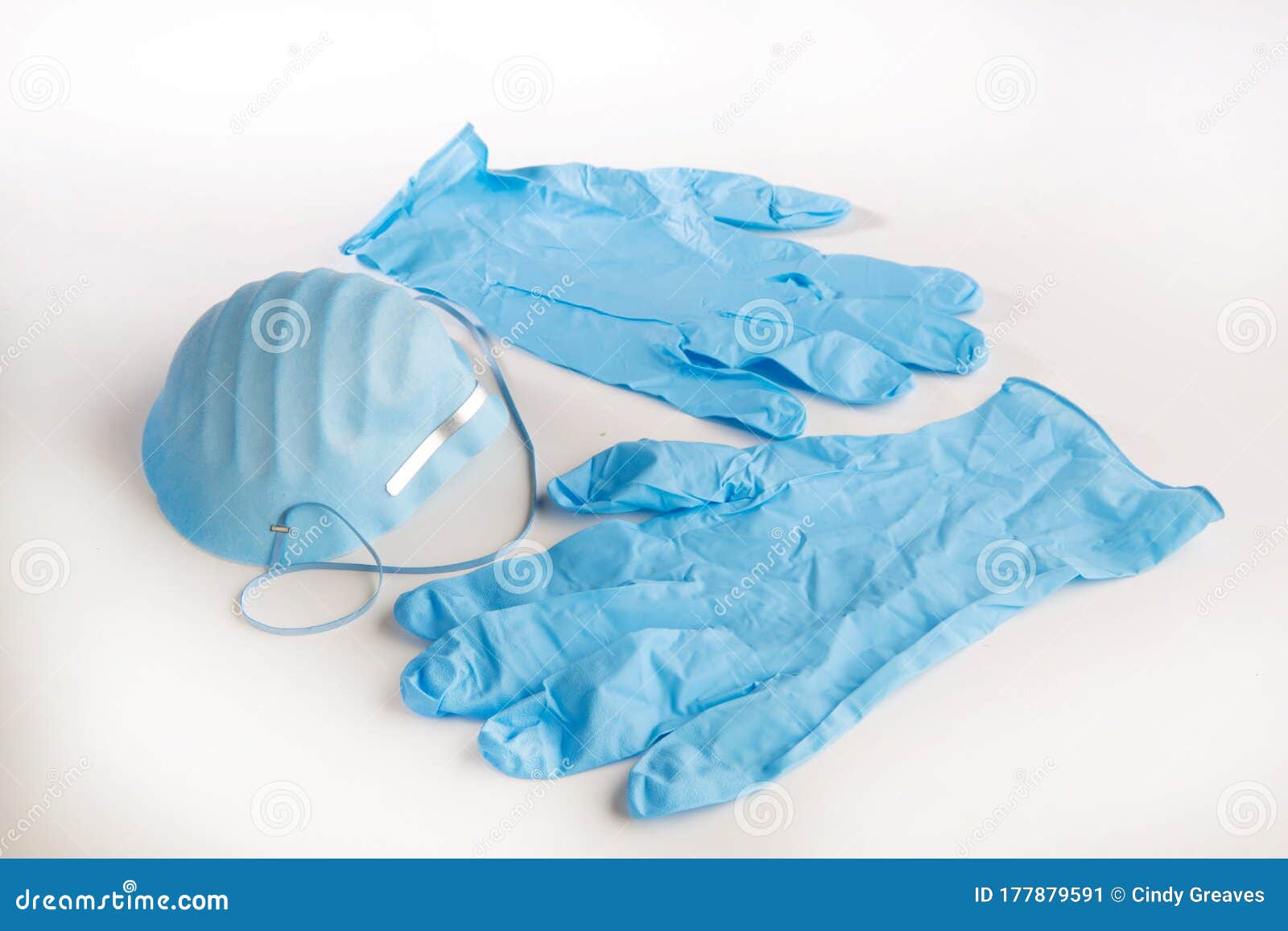 ppe blue gloves and a mask on white background