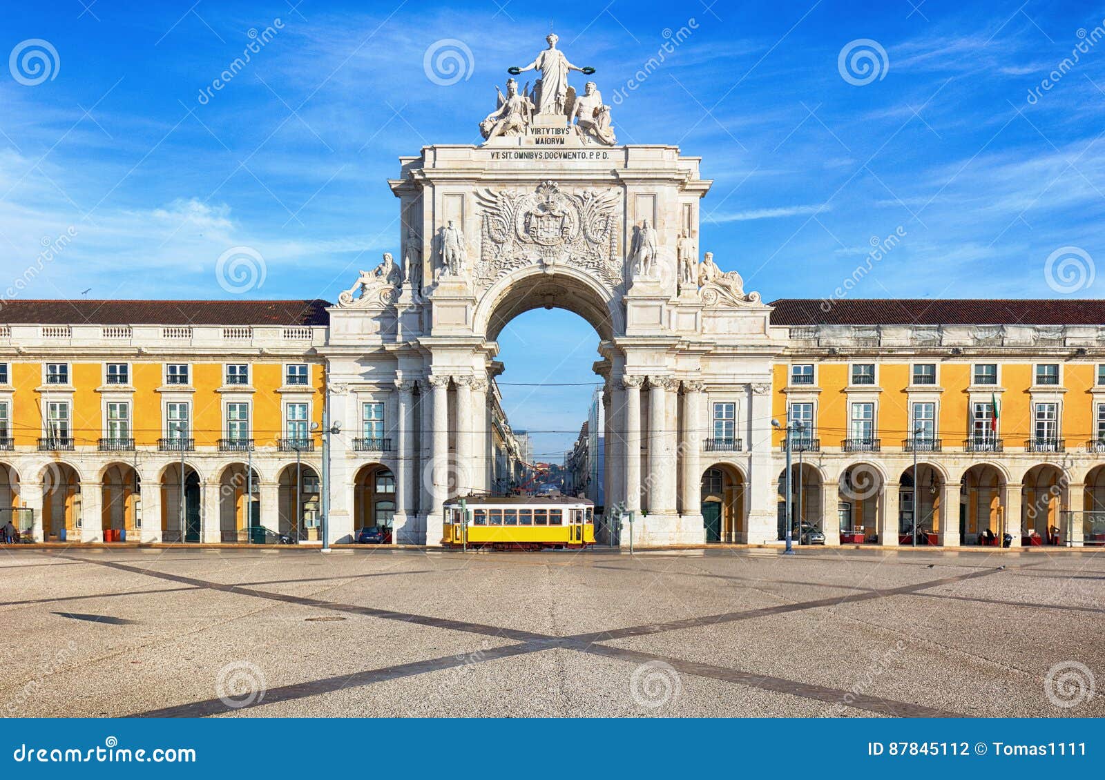 praca do comercio with yellow tram, lisbon, portugal
