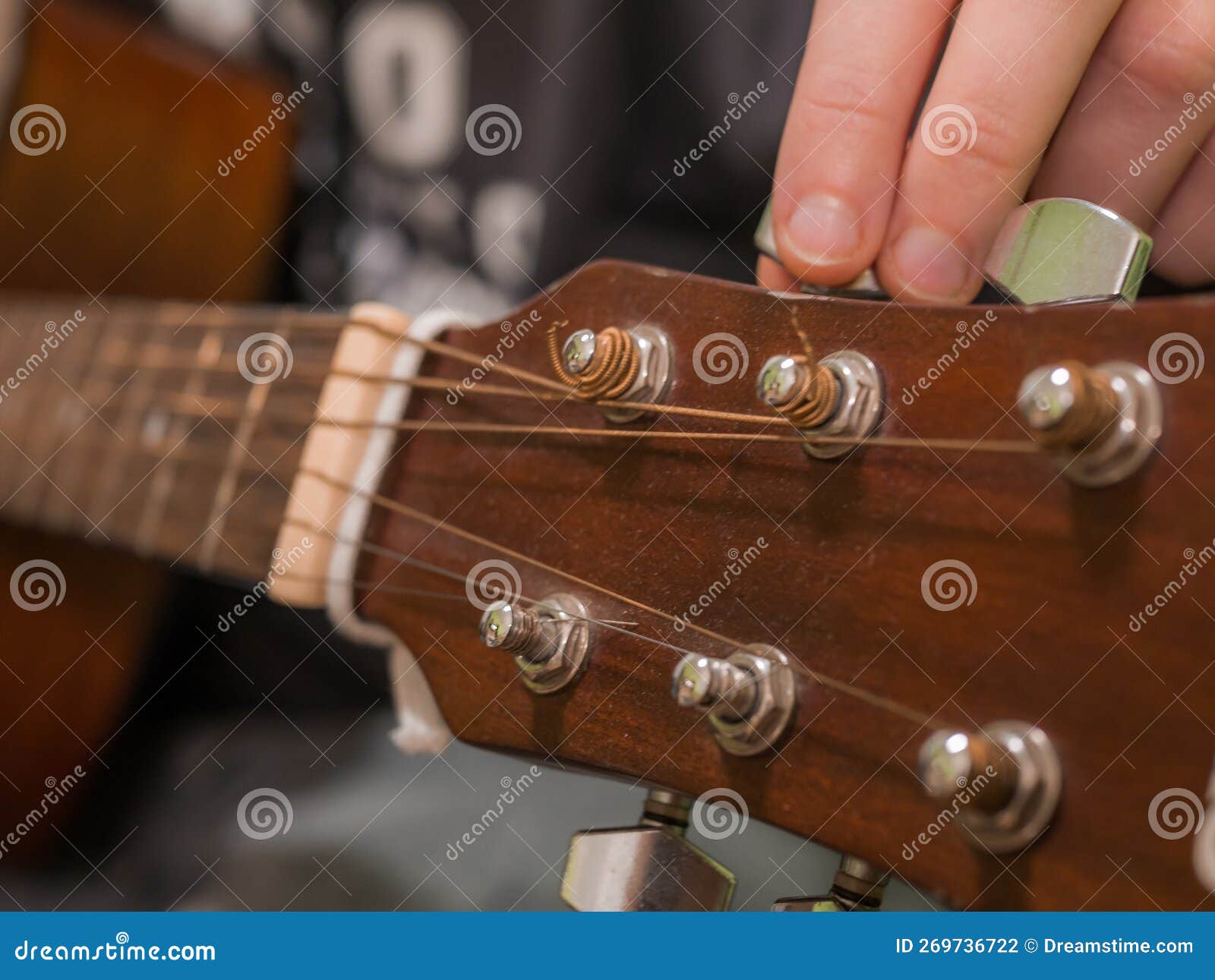 Practice Playing the Acoustic Guitar. Hands Playing Guitar and Picking Chords Stock Photo