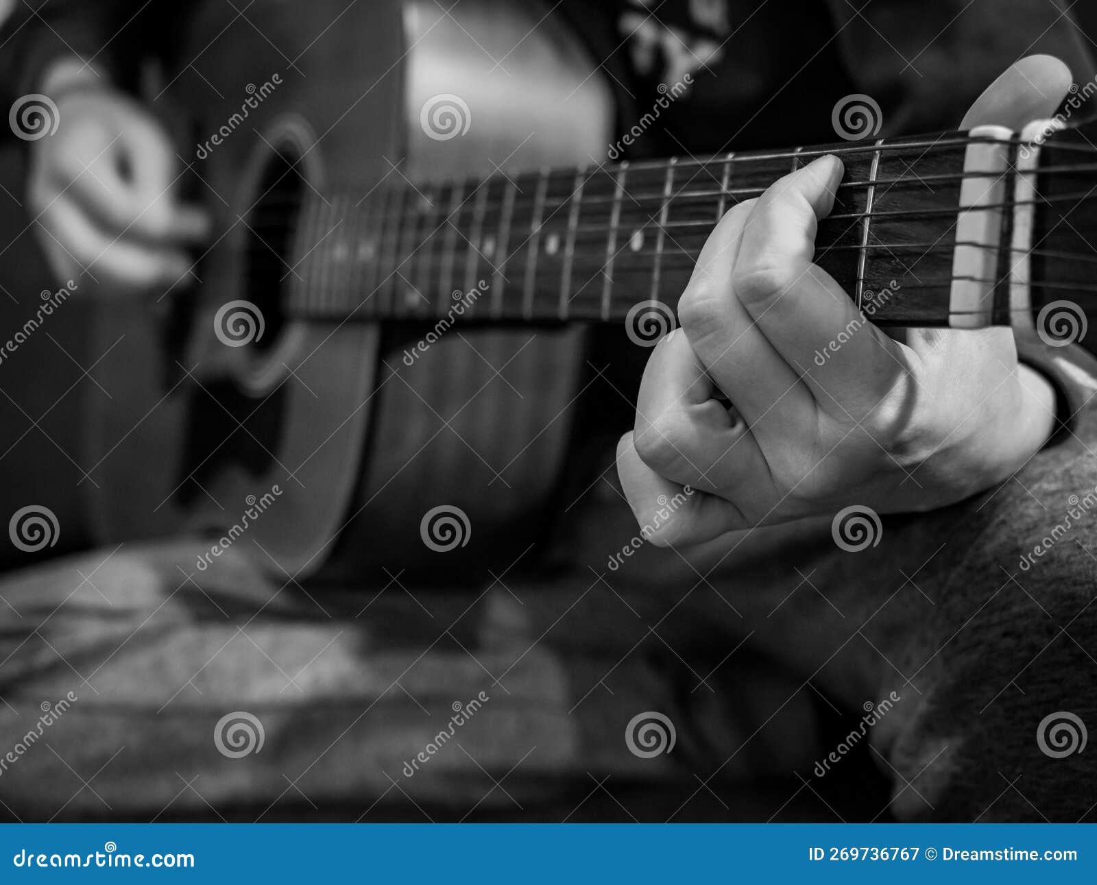Practice Playing the Acoustic Guitar. Hands Playing Guitar and Picking Chords Stock Image