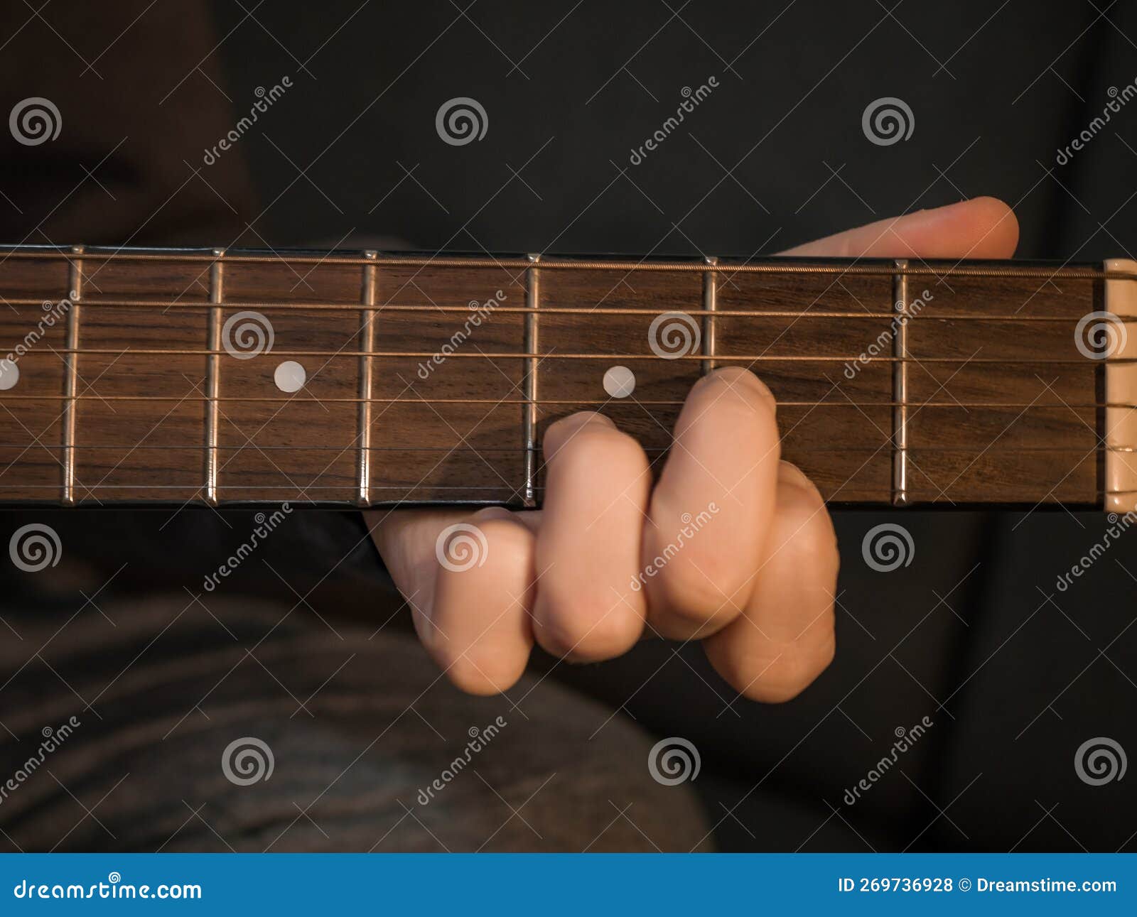 Practice Playing the Acoustic Guitar. Hands Playing Guitar and Picking Chords Stock Photo