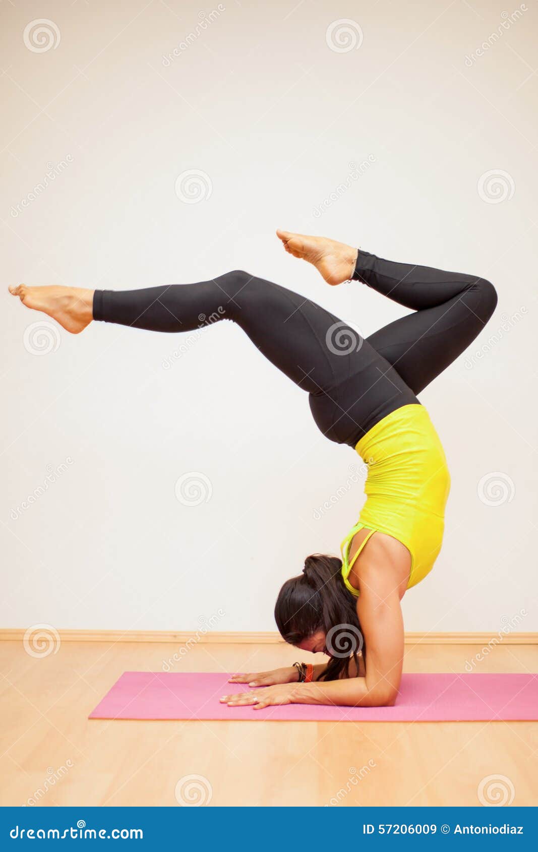 Practicing Some Yoga Poses In A Studio Stock Image - Image Of Background, Pose: 57206009