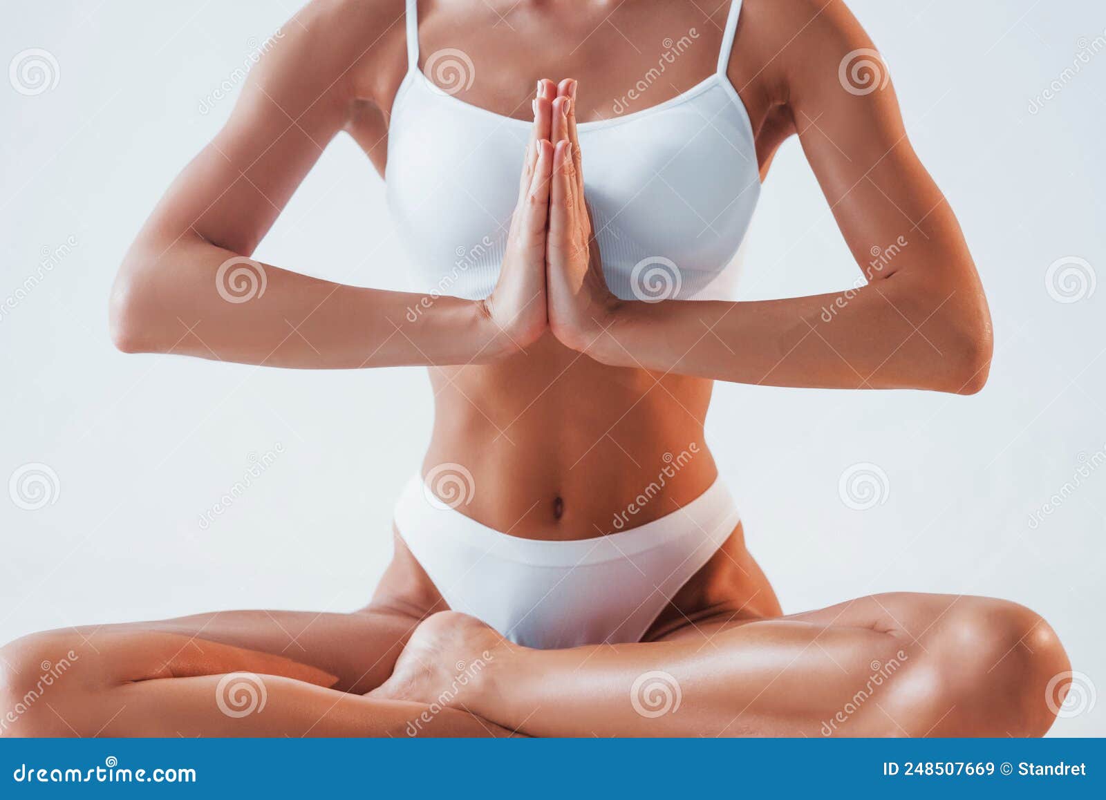 Practicing Yoga Exercises. Beautiful Woman with Slim Body in Underwear is  in the Studio Stock Image - Image of clear, beautiful: 248507669