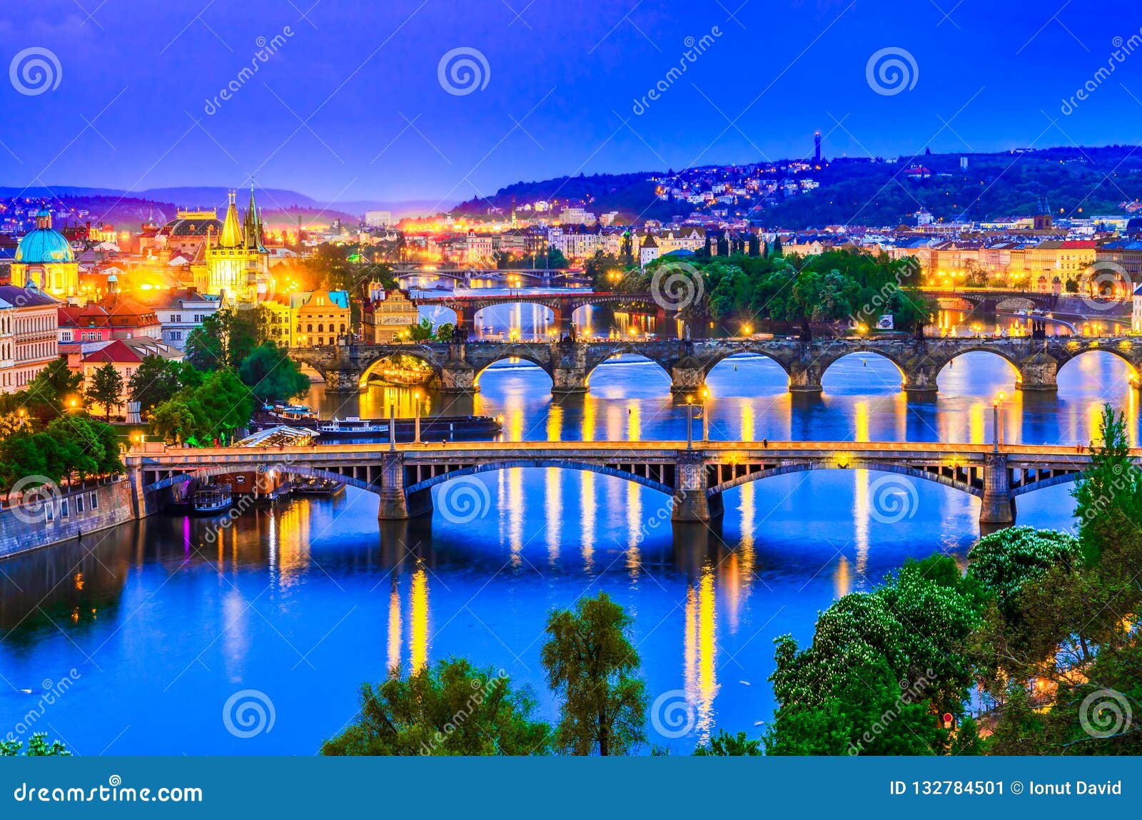 prague, czech republic: vltava river and its bridges at sunset