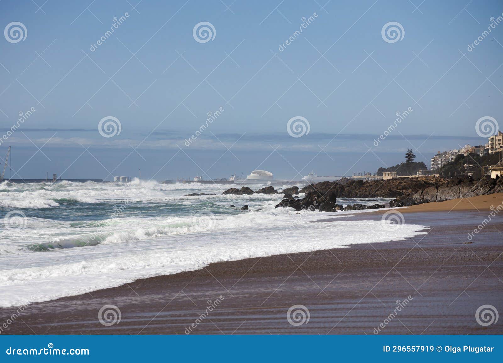 praia de carnero, sandy beach in porto with big waves of the ocean