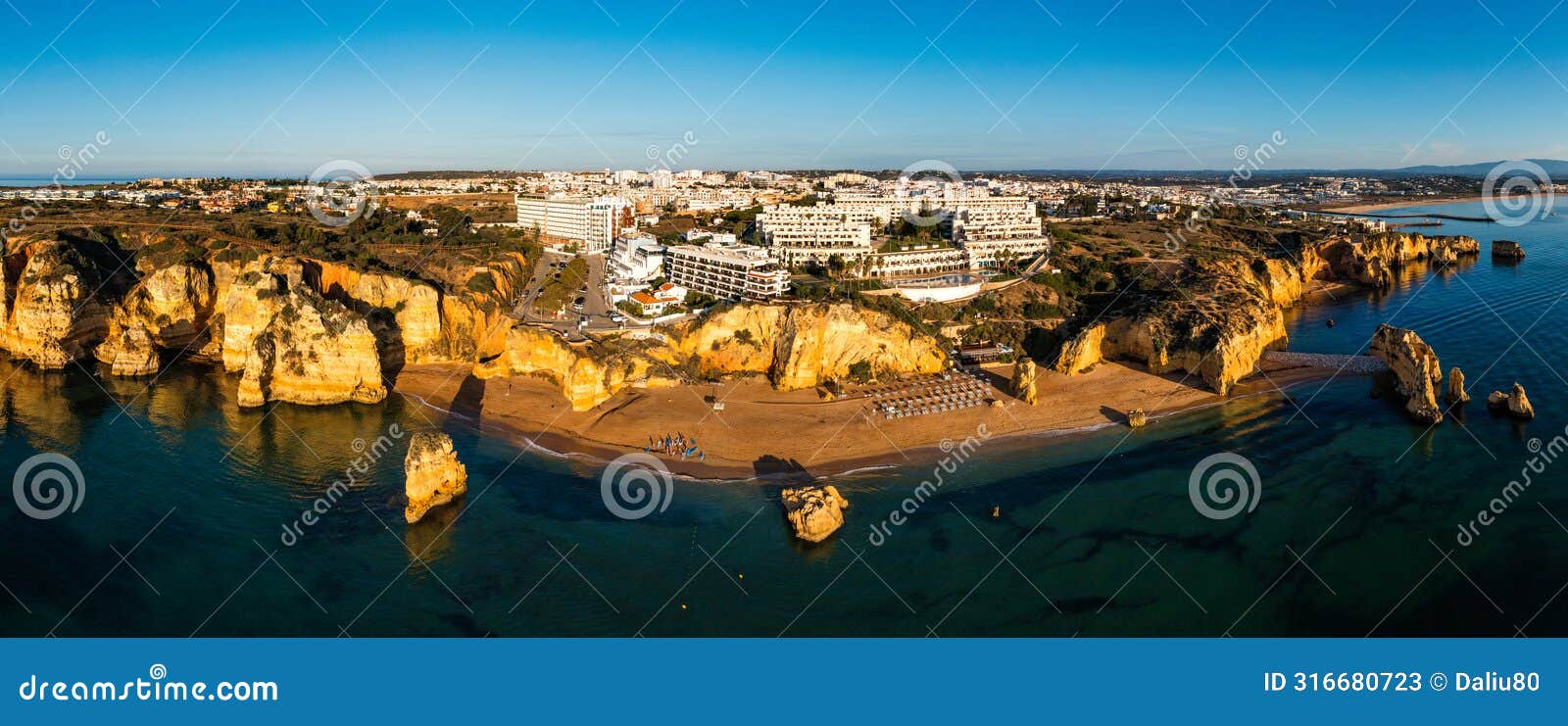 praia de dona ana beach with turquoise sea water and cliffs, portugal. beautiful dona ana beach (praia dona ana)