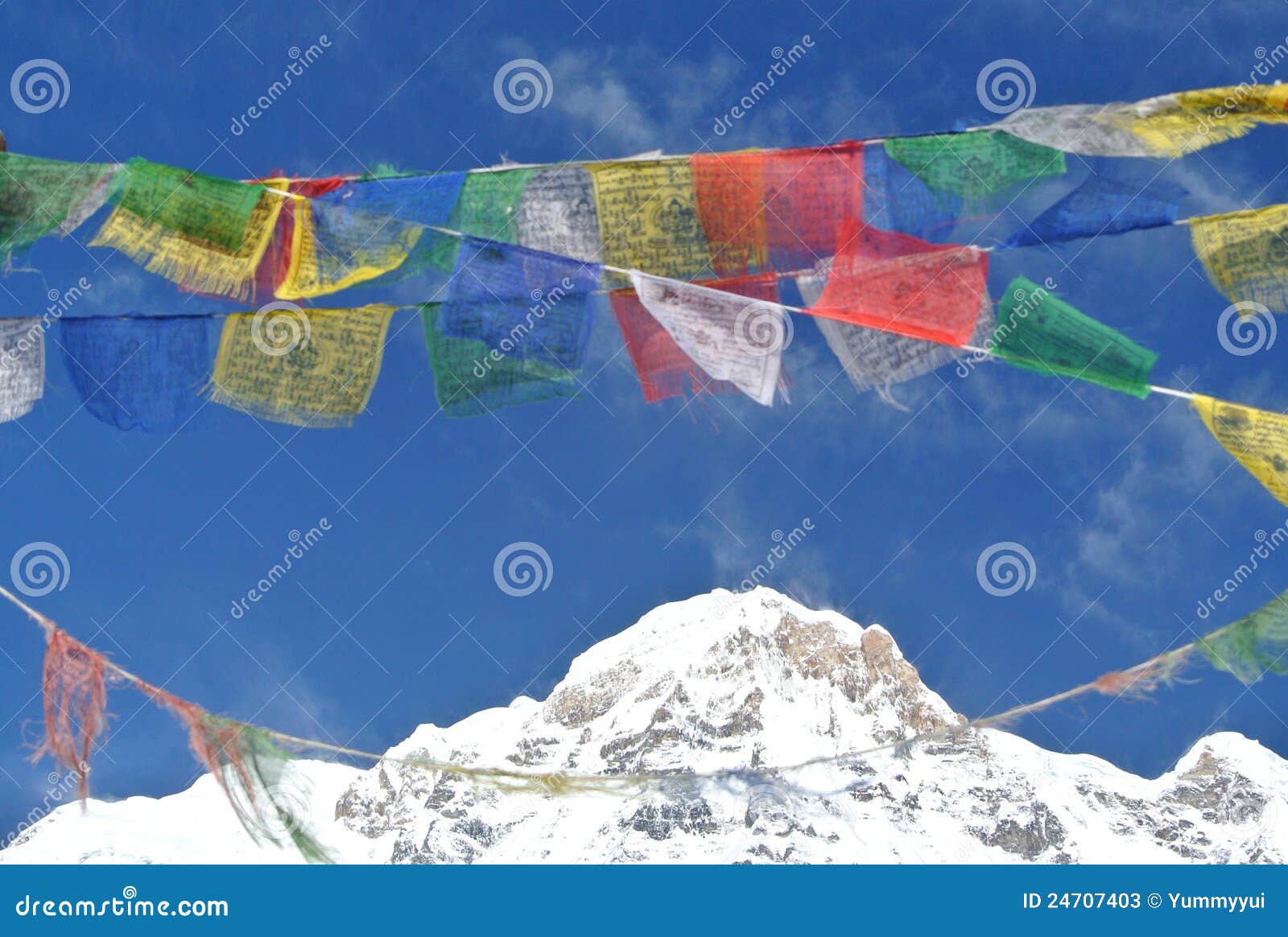 Prayer flags with a snow mountains