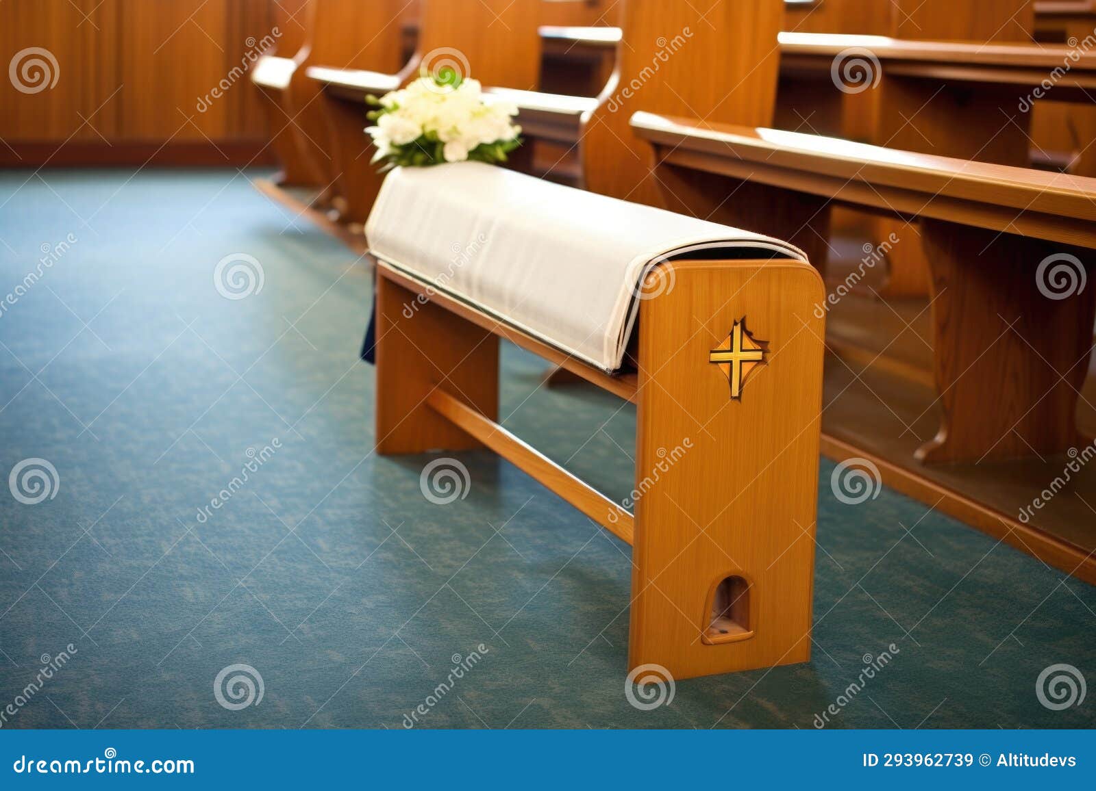 a prayer kneeler resting in an aisle