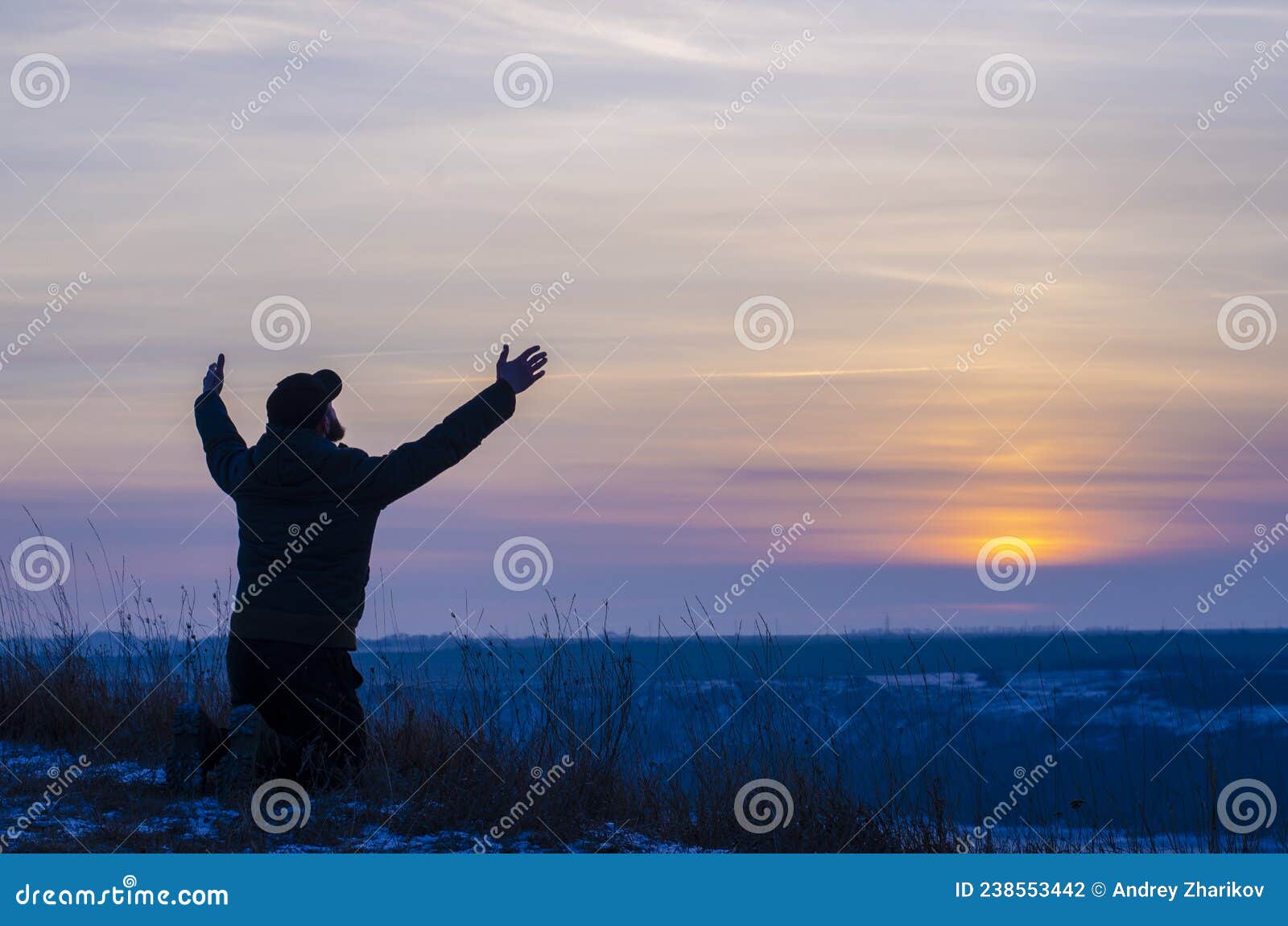 Prayer. Repentance. Silhouetted Men On A Background Of Blue Sky And ...