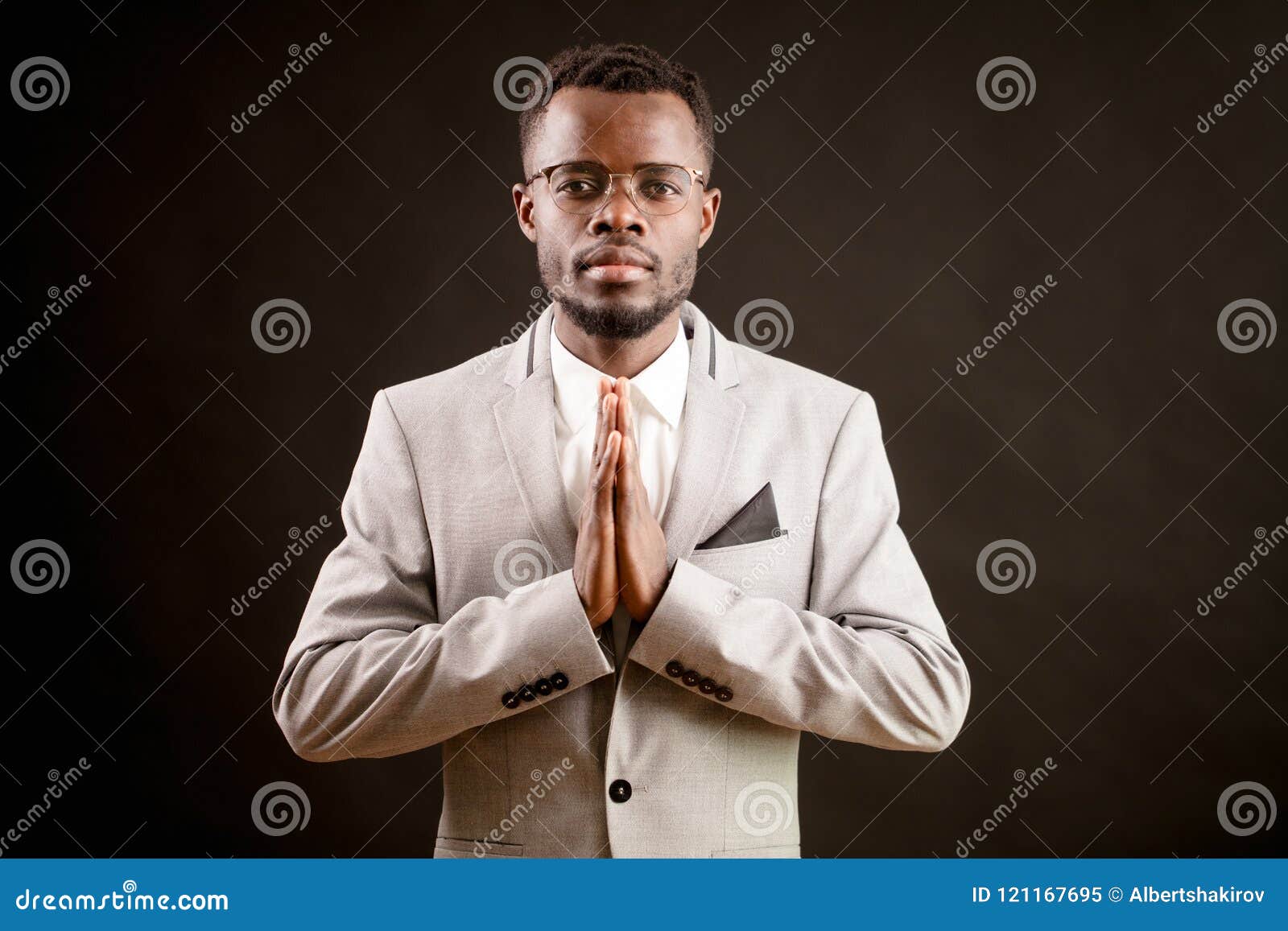 praying africanamerican man in good clothing. ask the god for health