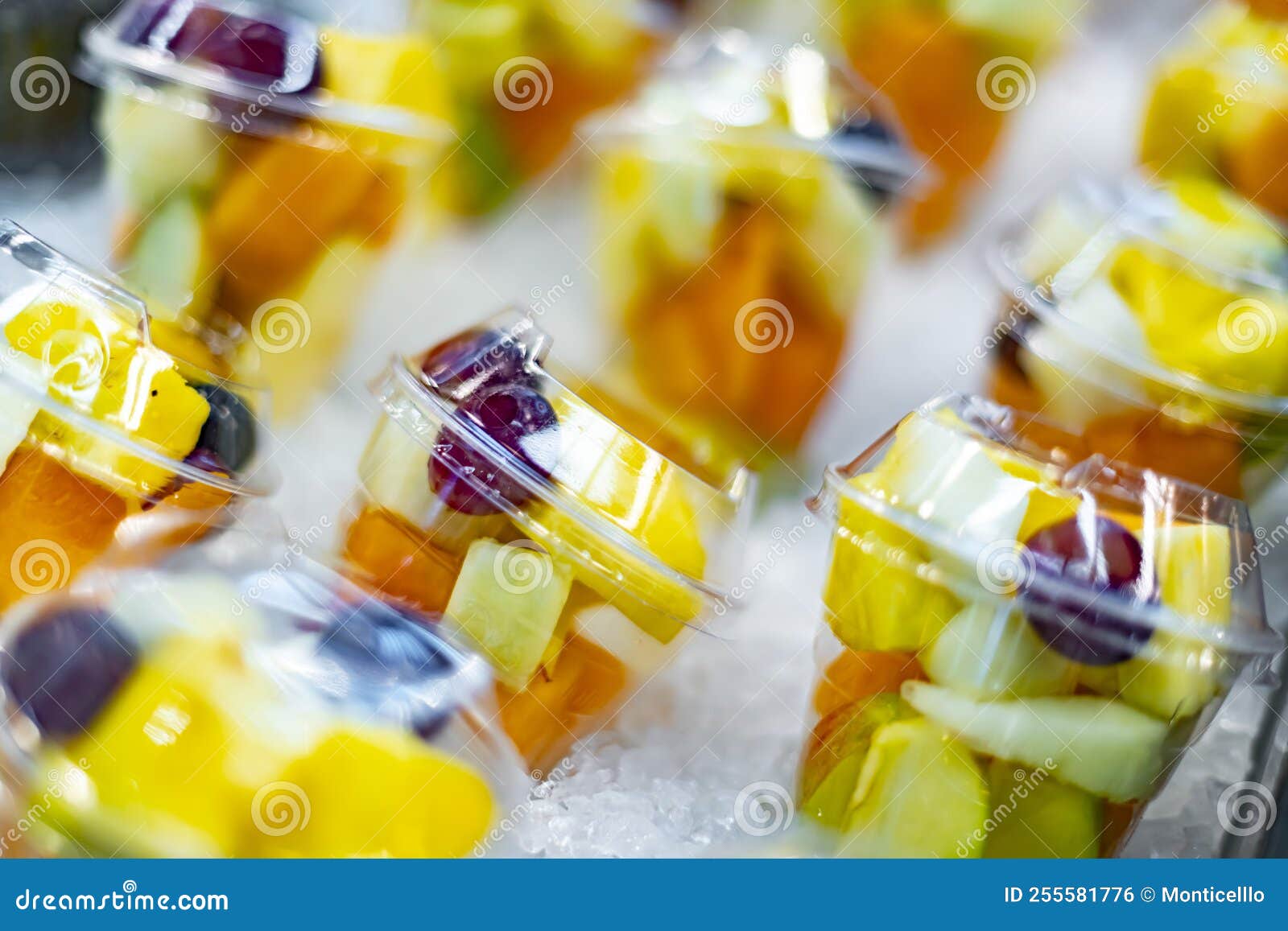 Prepackaged Fruit Salads Displayed in a Commercial Refrigerator Stock