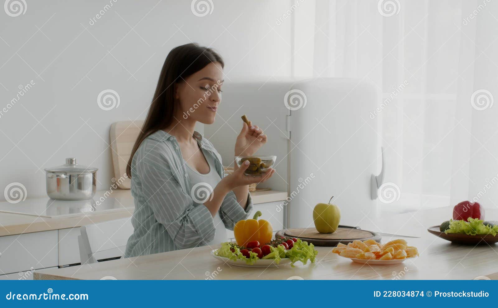 Pregnancy Cravings Young Pregnant Woman Eating Pickles In Kitchen Pregnancy Cravings Young Pregnant Woman Eating Pickles In Kitchen