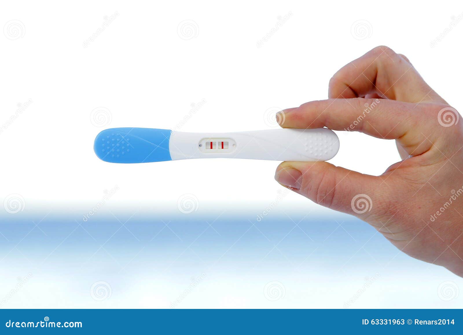 Pregnancy Test Positive Result Hand Holding Over Sea Horizon Stock Pregnancy Test Positive Result Hand Holding Over Sea Horizon Stock