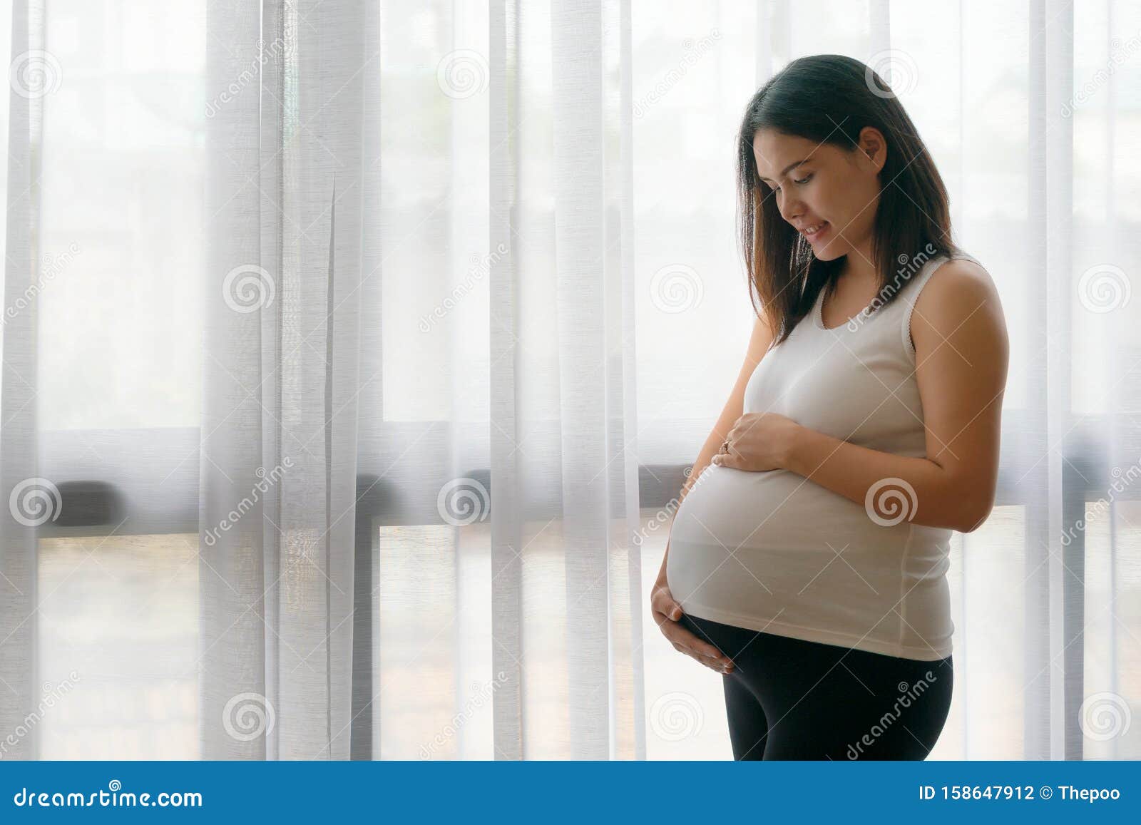 Pregnant Asian Woman Standing Near The Window Stock Photo Image Of