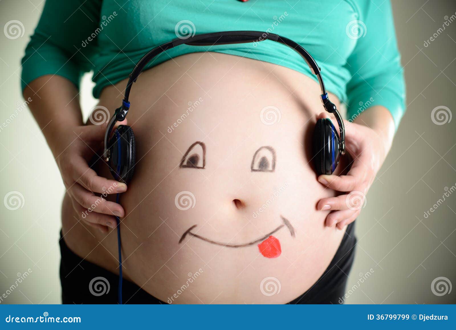 Pregnant Belly Listens To Music through Headphones Stock Image - Image of  listen, human: 36799799