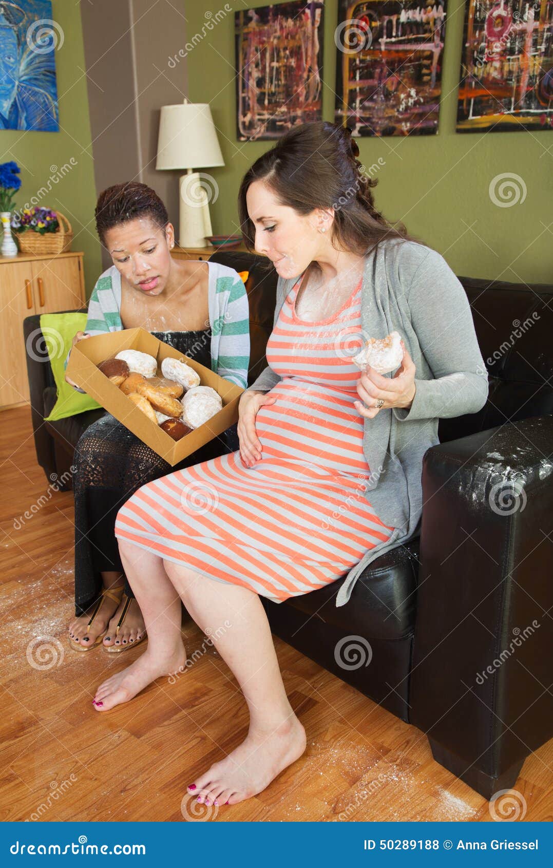 Barefoot Pregnant Lesbian - Pregnant Couple Eating Donuts Stock Photo - Image of lesbian, pastry:  50289188