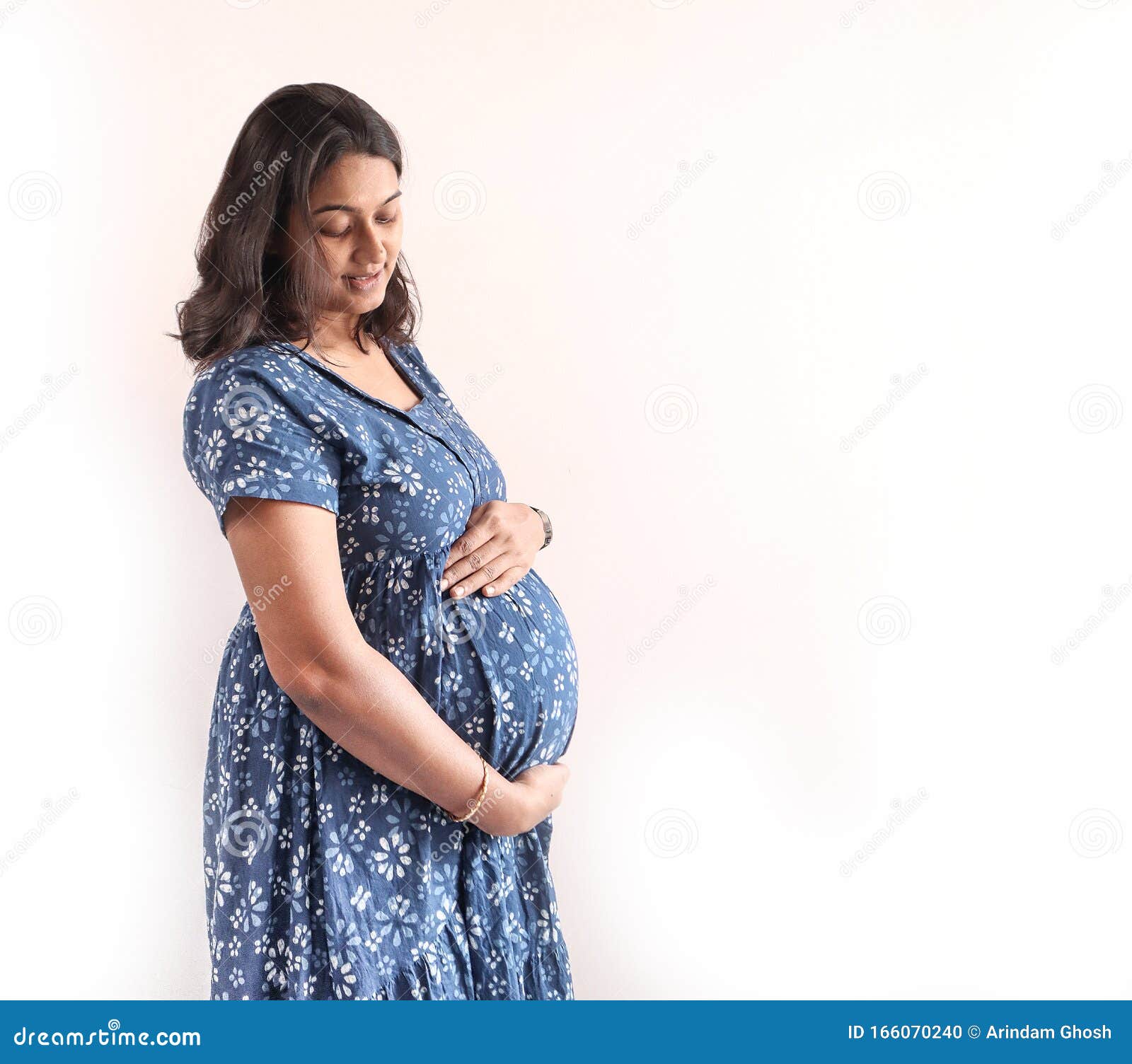 A Pregnant Indian Lady With Blue Dress And Hands On Belly Stock Photo Image Of Beautiful a-pregnant-indian-lady-with-blue-dress-and-hands-on-belly-stock-photo-image-of-beautiful
