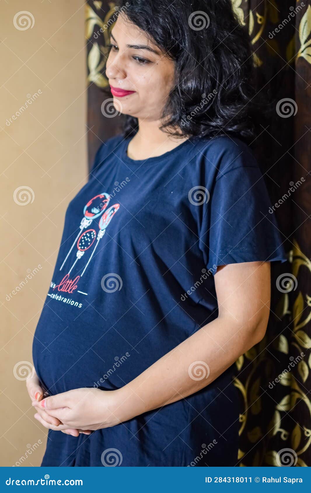 A Pregnant Indian Lady Poses For Indoor Pregnancy Shoot And Hands On